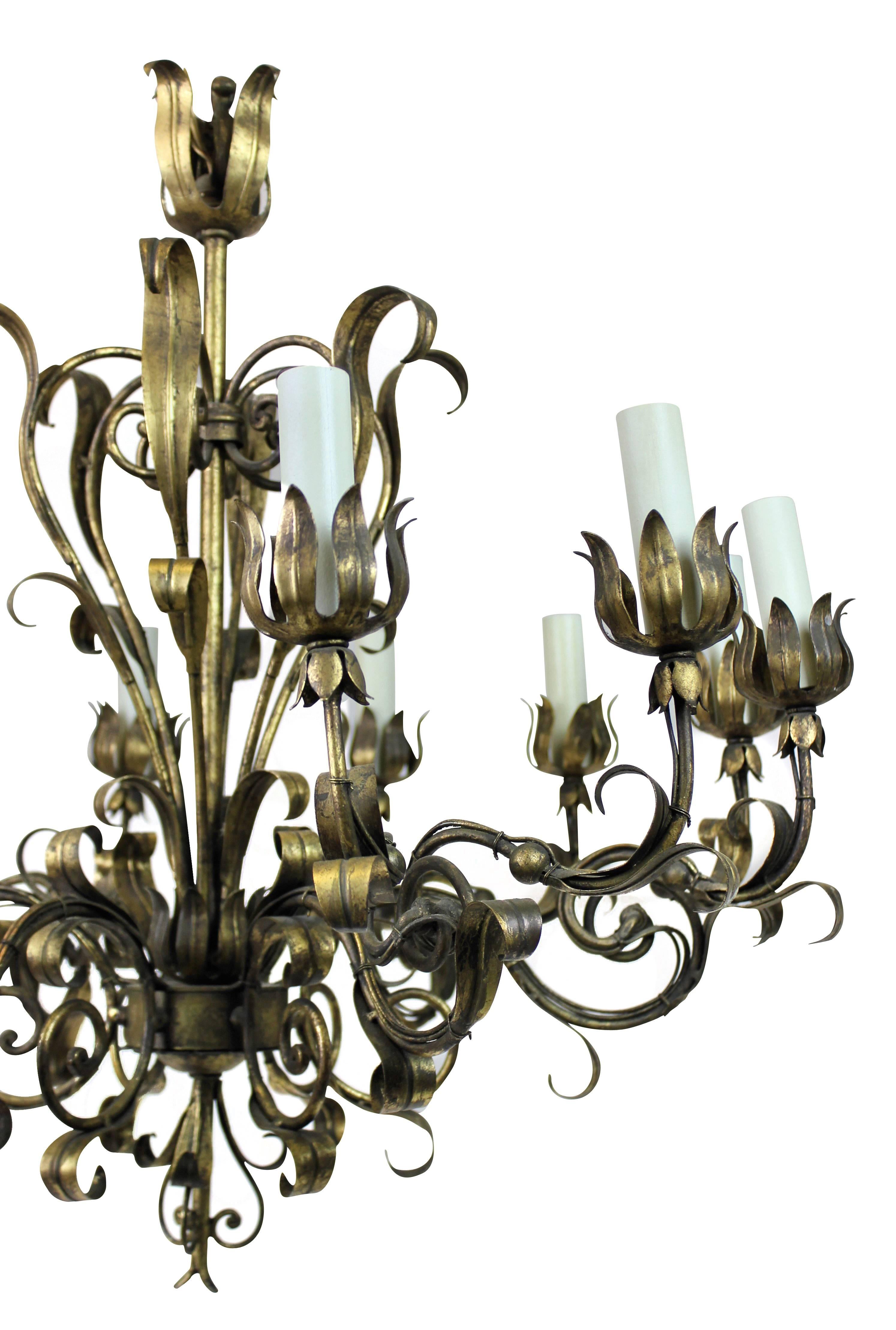 An Italian twelve-light chandelier in gilt metal, of scrolling form.