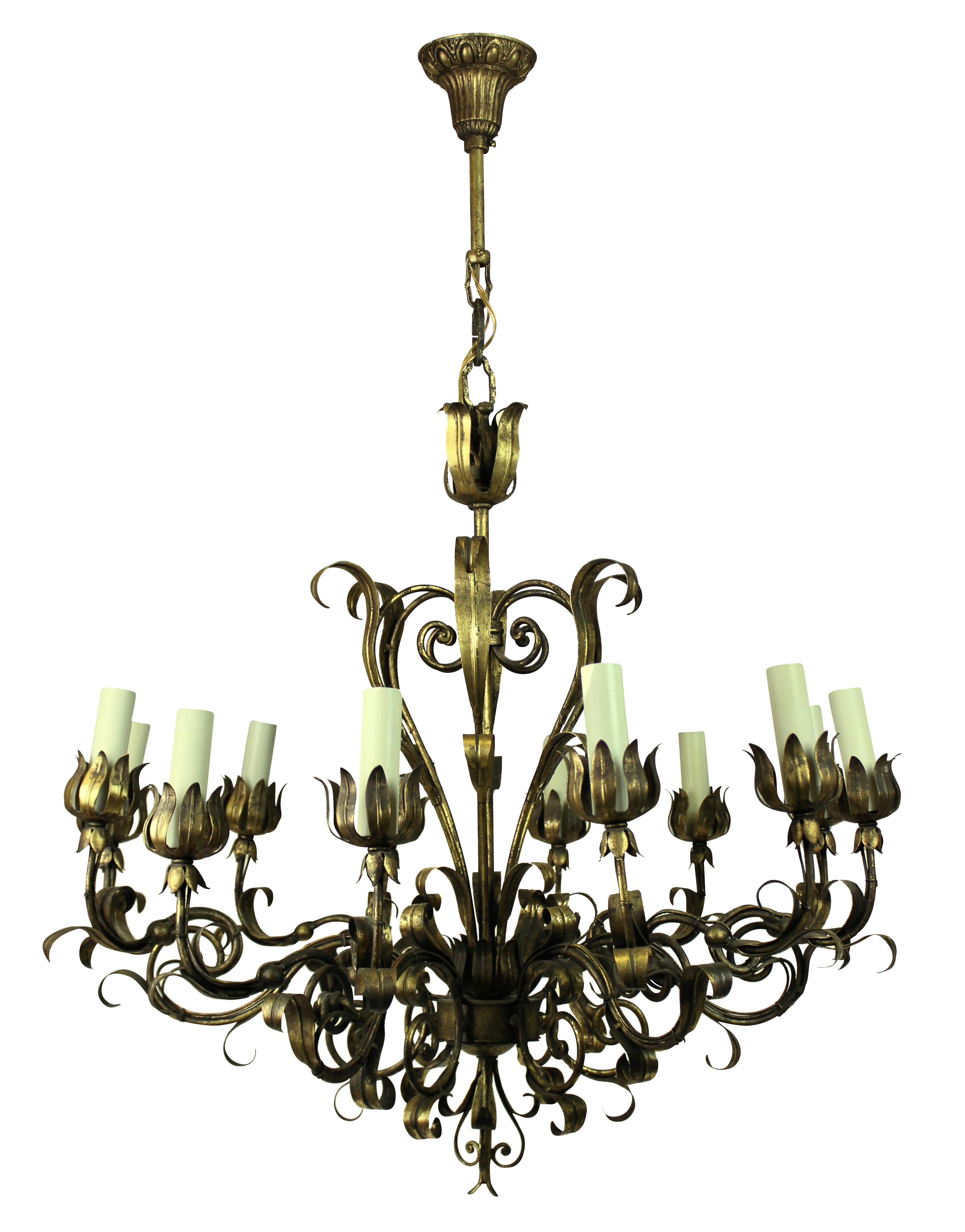An Italian twelve-light chandelier in gilt metal, of scrolling form.