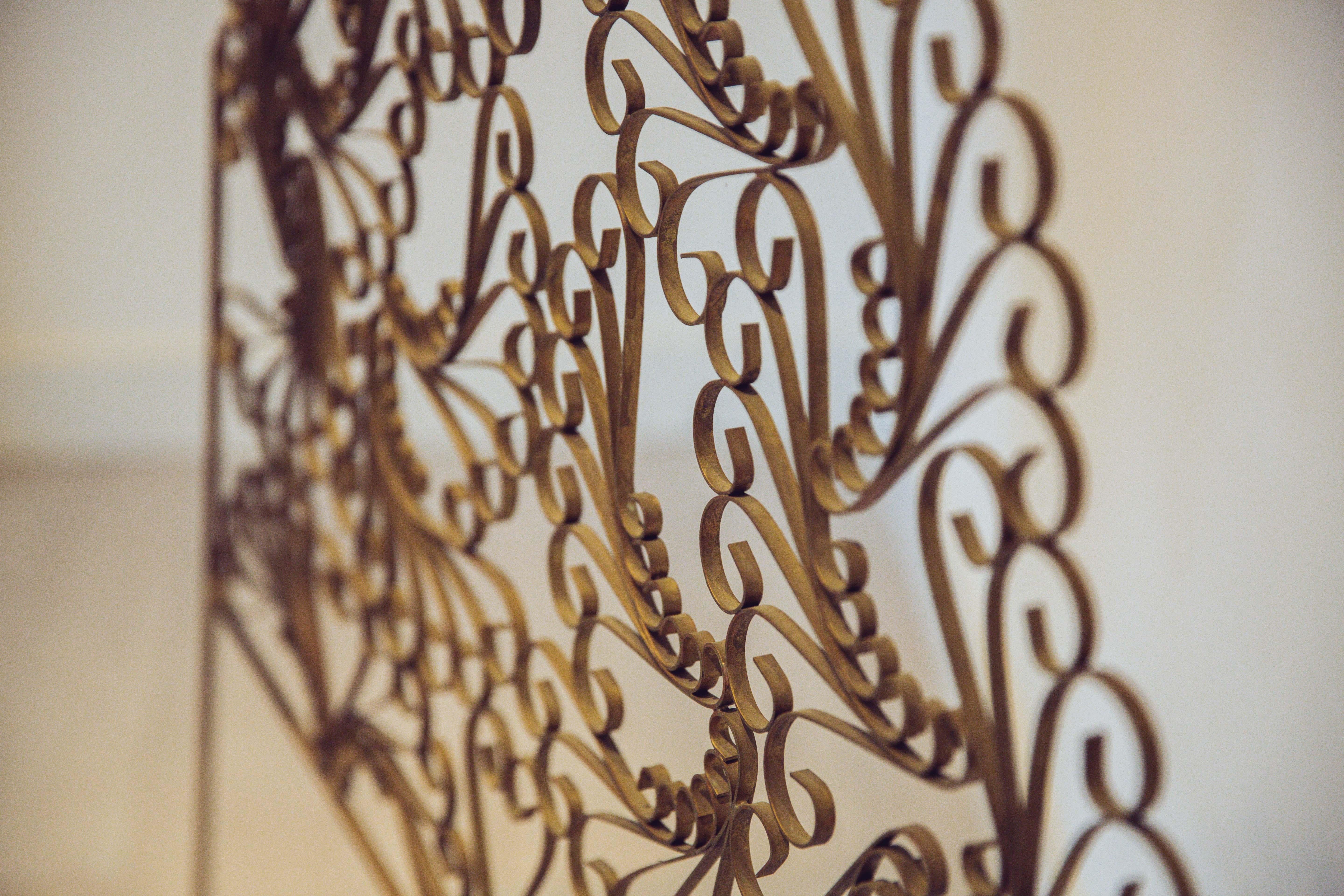 Extraordinaire and unique gilded wrought iron vintage headboard. Elegant swirls that is inspired by the iconic peacock chairs. It would be a perfect fit for a single bed in the guest room or kidsroom.
