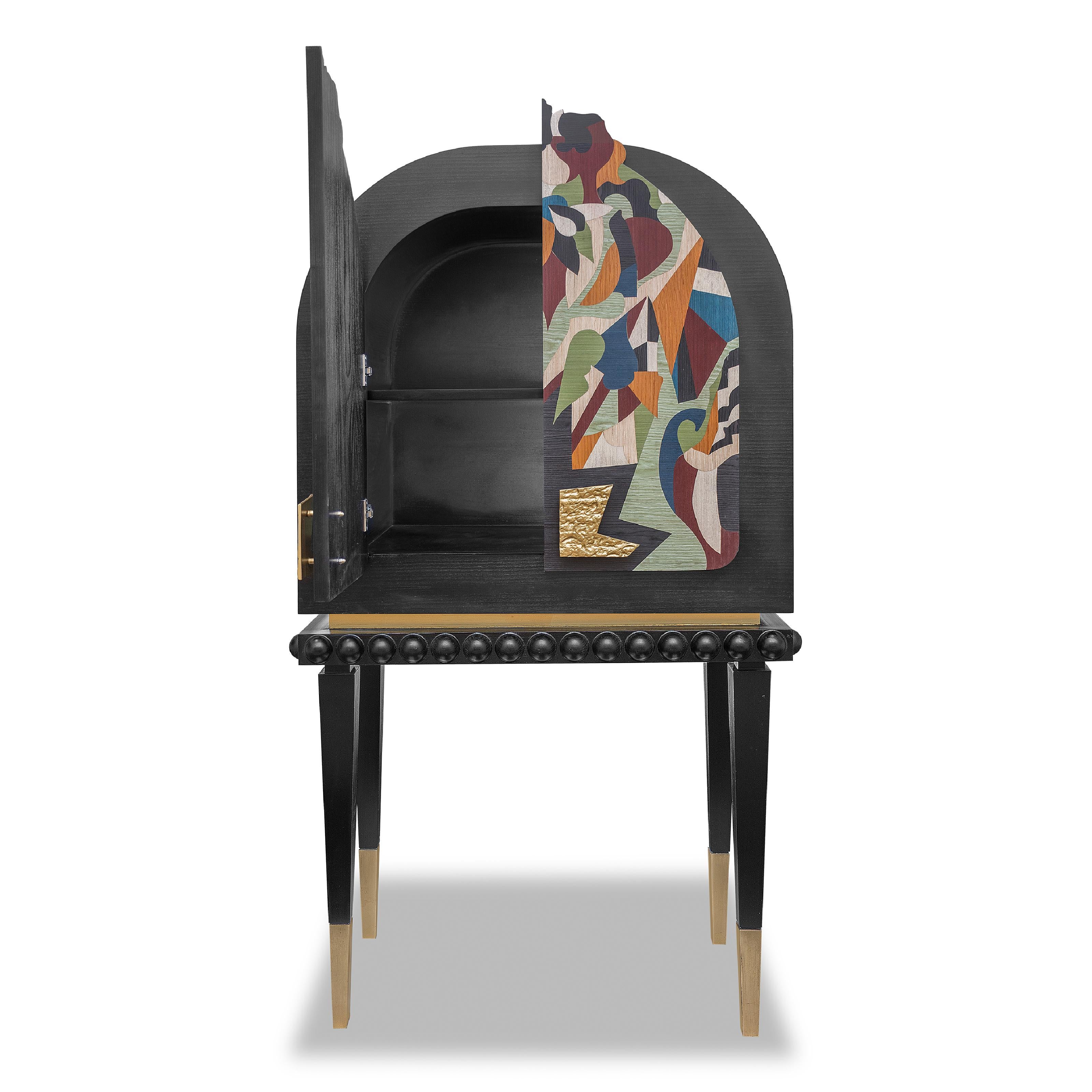 The cabinet design is inspired by Karim Ataya's painting of Gilgamesh, showcasing its essence through robust structure, bold lines, and intricate carvings. Floral motifs, soft curves, and a nature-inspired color palette bring tranquility and grace,