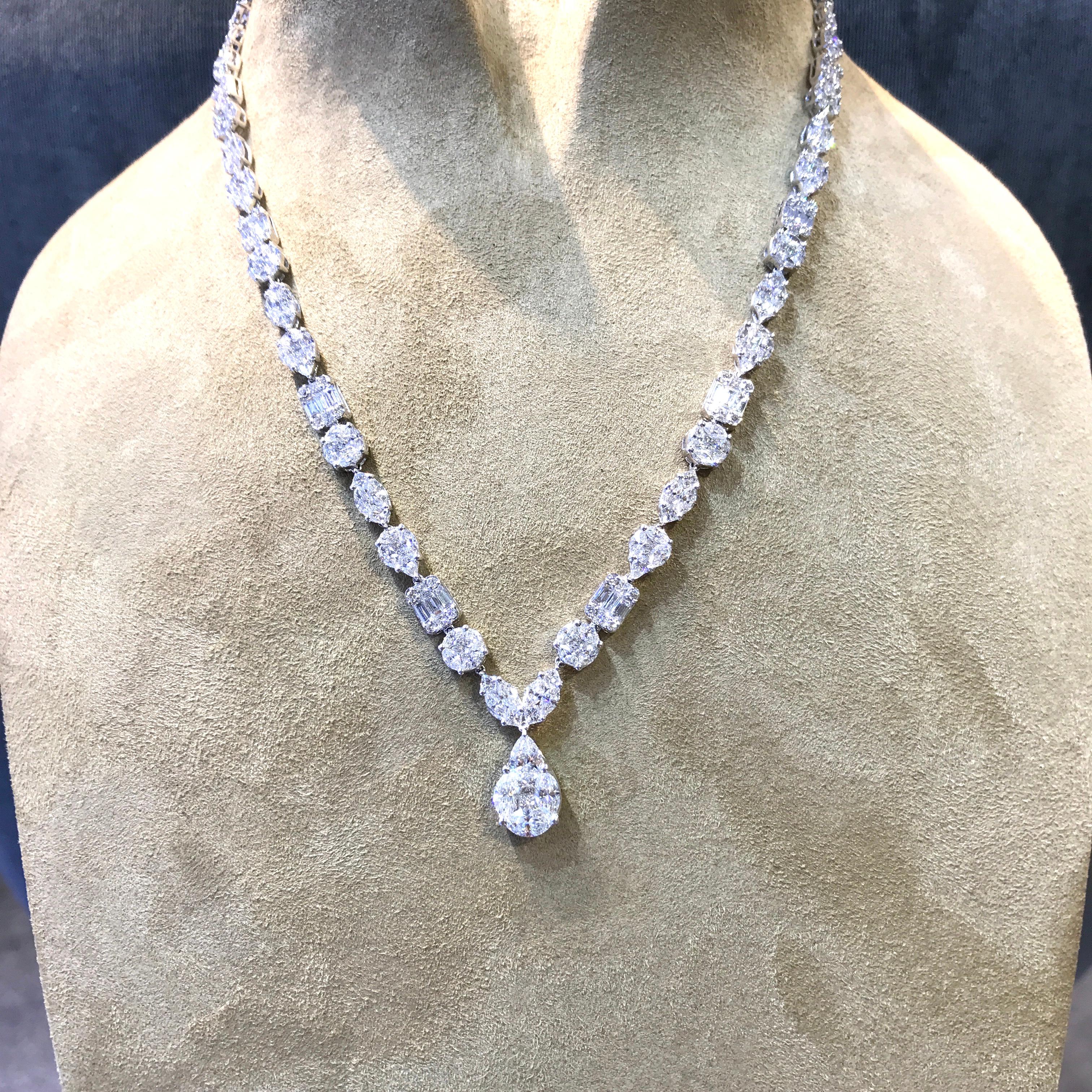 Glamour drops collection - glamour is a sense of luxury , GiLIN 's master craftsmen have set the white diamonds at different angles to form a beautiful necklace with different size diamond drops . The setting maximize the fire and brilliance . It's