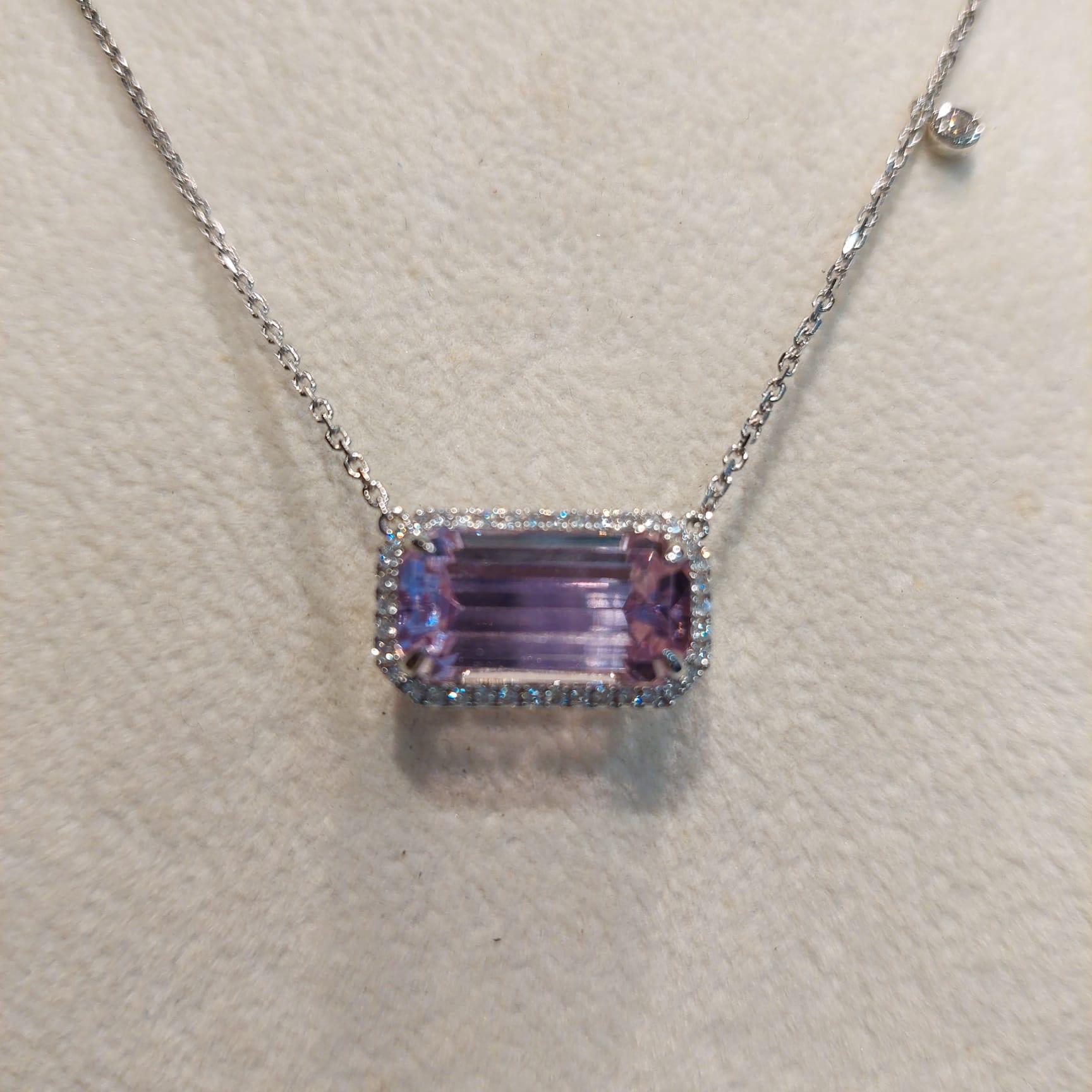 Kunzite is a variety of spodumene, a pyroxene mineral. While spodumene naturally occurs in diverse colors, kunzite is typical of the pink to purple variety.

The Centre Kunzite weighs 9.33 carat, with 39 pieces 0.32 Carat of diamonds beautifully set