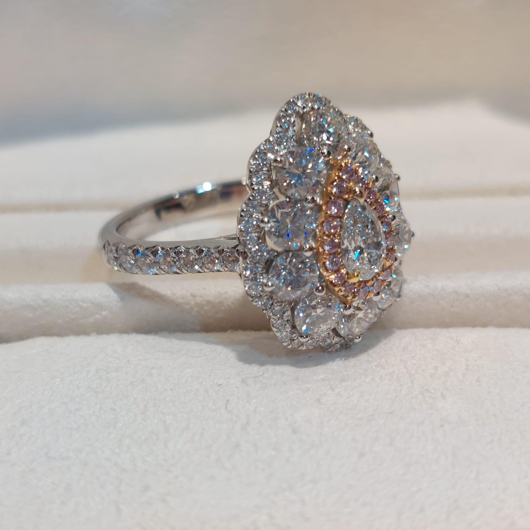 Diamonds symbolize love and beauty, pink diamonds are associated with femininity and romance, often used as symbols of tenderness or sweetness, and pink diamonds are also said to represent gracefulness and elegance.

This gorgeous ring setting in