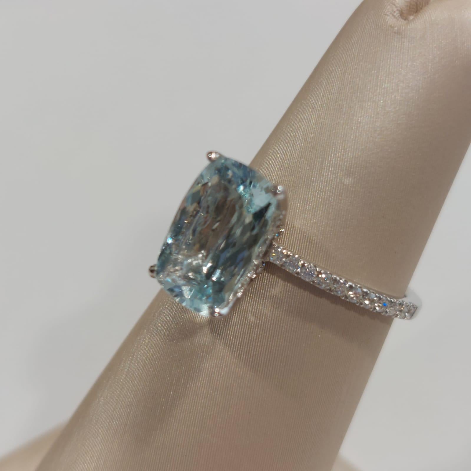 Aquamarine Ring sometimes called the “mermaid stone,” aquamarine adds a sea-like sparkle to any wedding or engagement ring.

The Centre Aquamarine weighs 1.97 Carat, with 0.28 Carat of diamonds beautifully set around it. The ring is made in 18K