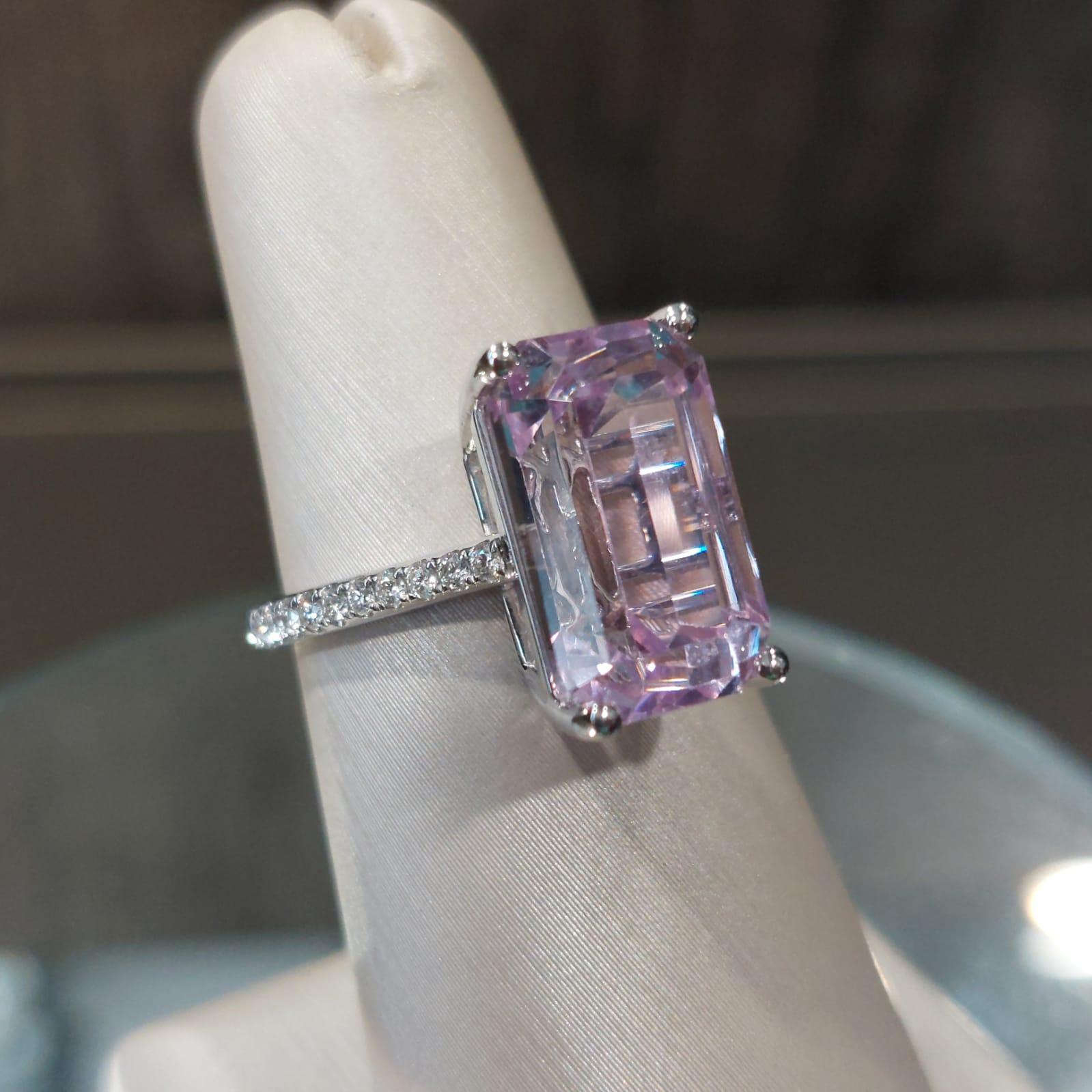 Kunzite is a variety of spodumene, a pyroxene mineral. While spodumene naturally occurs in diverse colors, kunzite is typical of the pink to purple variety.

The Centre Kunzite weighs 8.49 Carat, with 20 pieces 0.18 Carat of diamonds beautifully set