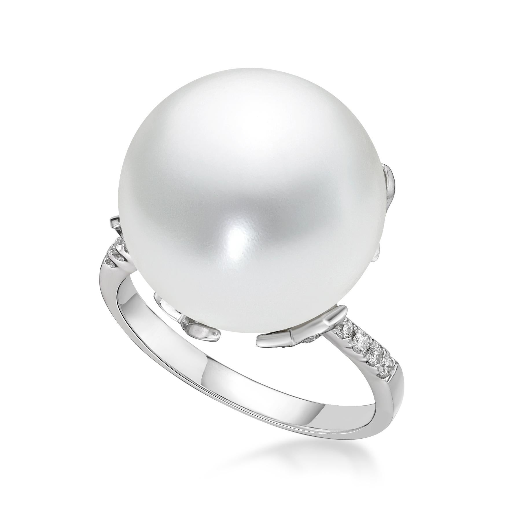White pearls symbolize innocence, beauty, sincerity, and new beginnings. This is what makes the white pearl a true classic for bridal jewelry.

The center pearl as 15mm, and the side diamond as 0.22 carat, made in 18K white gold.

