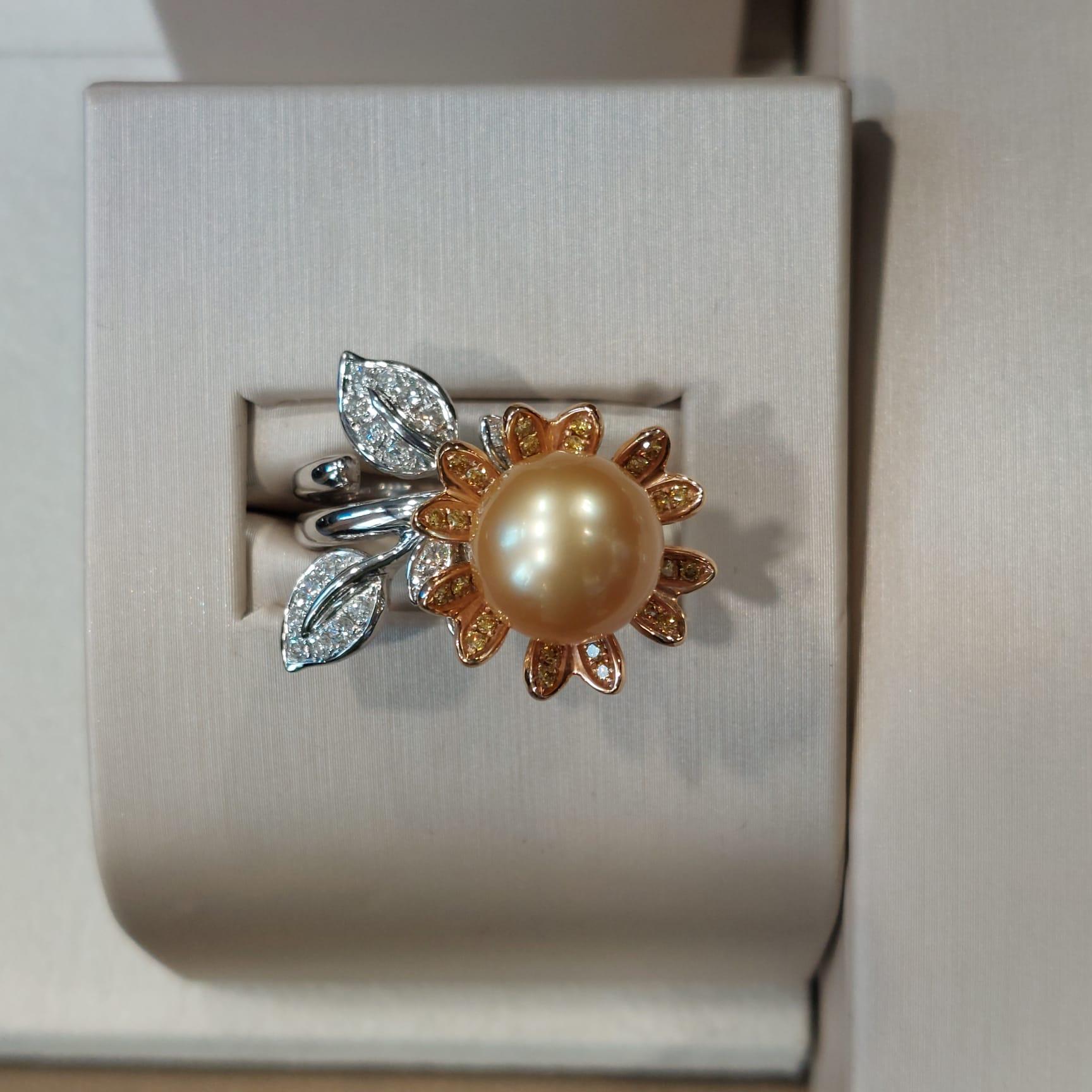 Pearls symbolize loyalty, integrity, generosity, and purity, elegant and unique.

The center pearl is 11.5mm x 11.7mm, diamond totally is 24 pieces 0.39 carat, yellow diamond totally is 26 pieces 0.33 carat, made in 18K white rose gold.

