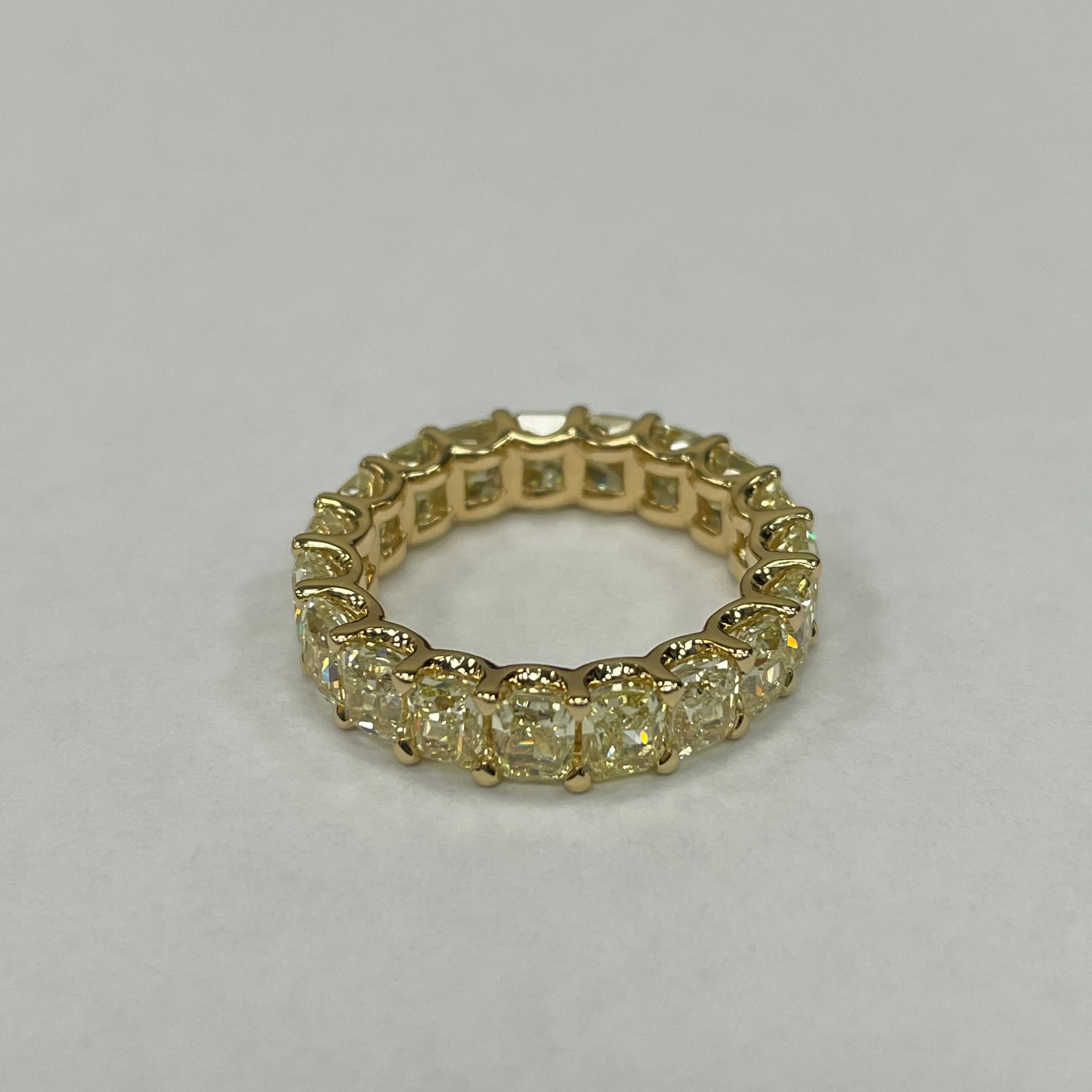 18K yellow gold eternity Band featuring radiant-cut yellow diamonds with a high polish finish. Totalling 19 pieces of brillant cut radiant diamonds, weighing 6.339 carats, the width is 4mm. 
Ring size only can sizing down to US#5, cannot sizing it