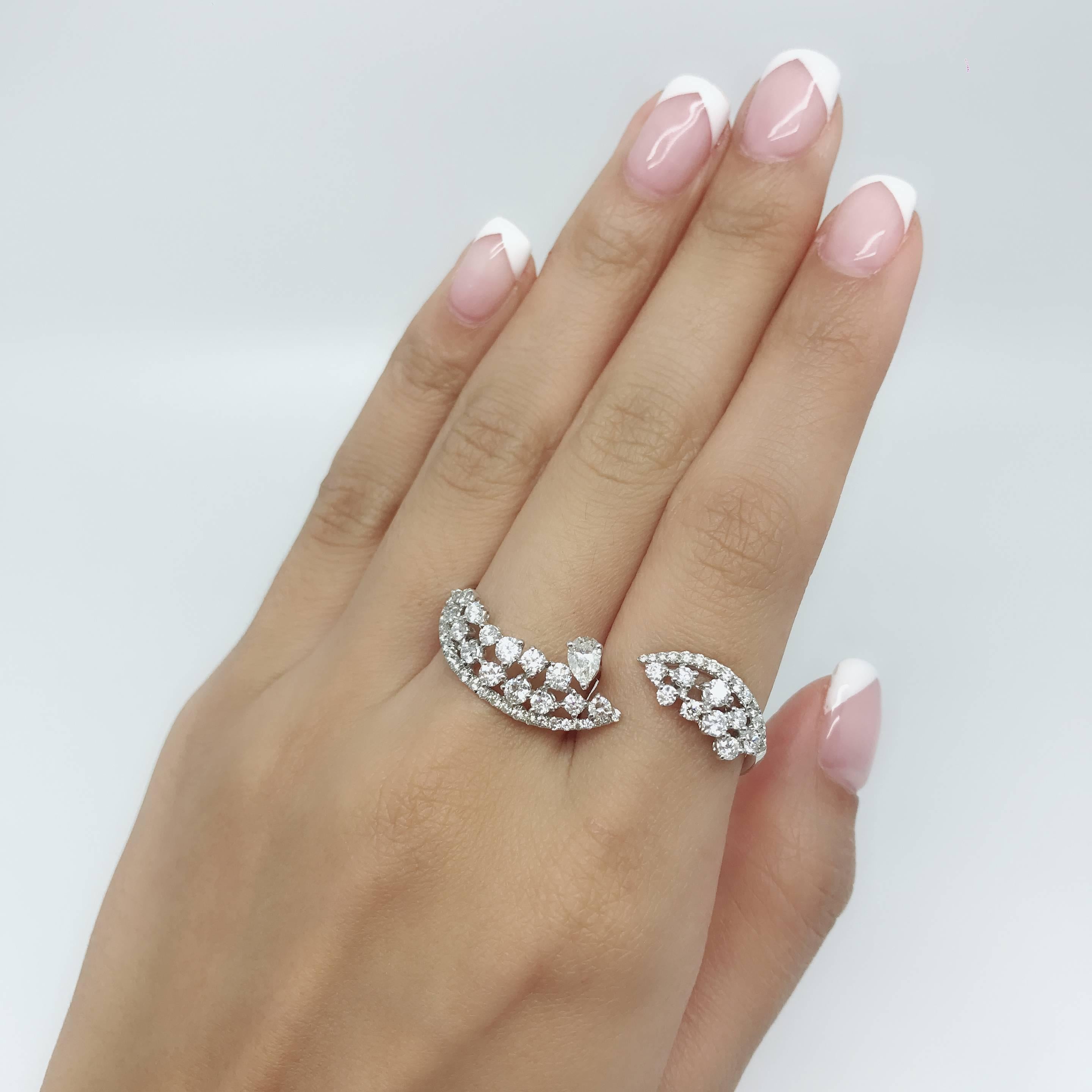 This gorgeous 2-finger diamond ring, handcrafted by GILIN, featuring a 0.30 carat Marquise cut diamond in the centre and 1.90 carat round brilliant diamonds along side. Ring is set in 18 Karat white gold.
