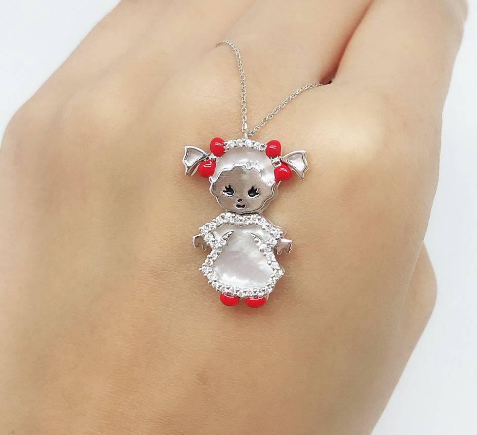 An adorable, cute little girl pendant necklace made in 18K White Gold, 0.21 carat of diamond, 3.23 carat of Mother of Pearl and Enamel. It is an ideal gift for mothers who have daughters and for the daughters themselves.