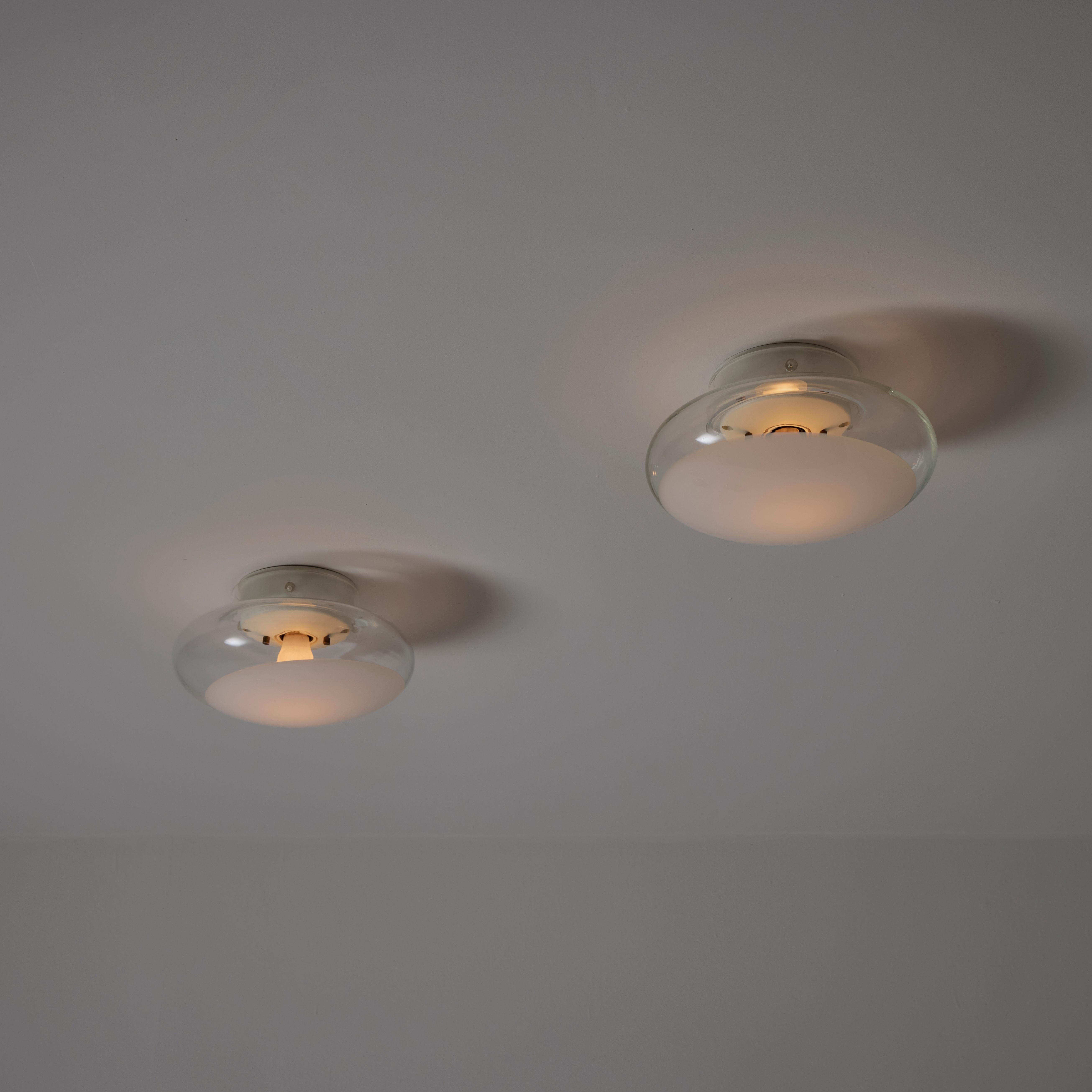 'Gill 40' Wall or Ceiling Lights by Roberto Pamio for Leucos. Designed and manufactured in Italy, circa the 1960s. Opaline glass with clear side cuts, giving access to inner workings. These hold a single E27 socket-type, adapted for the US. Rewired