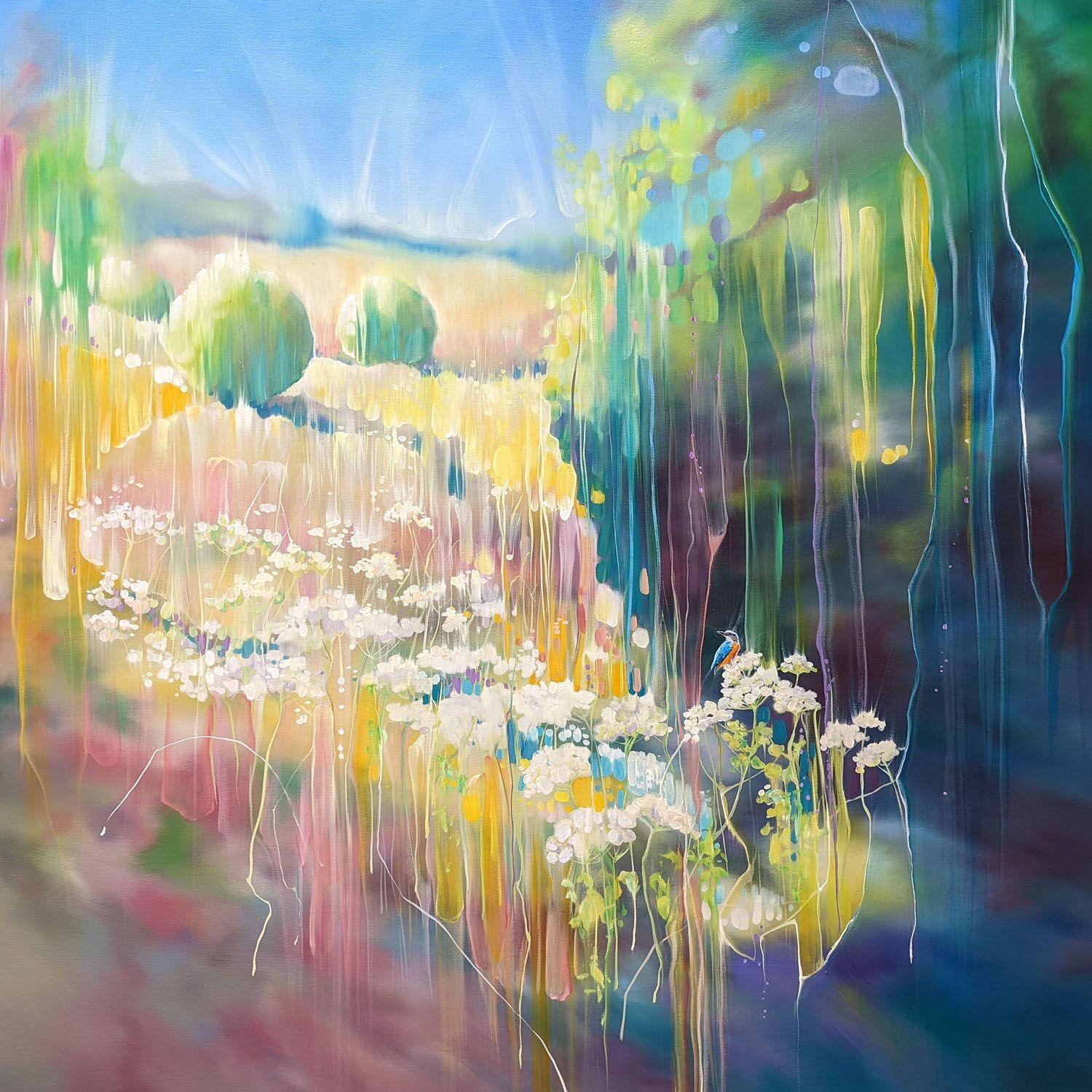 The Jewel of the River is a 40x40x1.5 inches oil painting of a kingfisher by a river surrounded by fields and wildflower meadows. The edges of the painting are blurred so that you are transported into it across the white lacy cow parsley flowers in