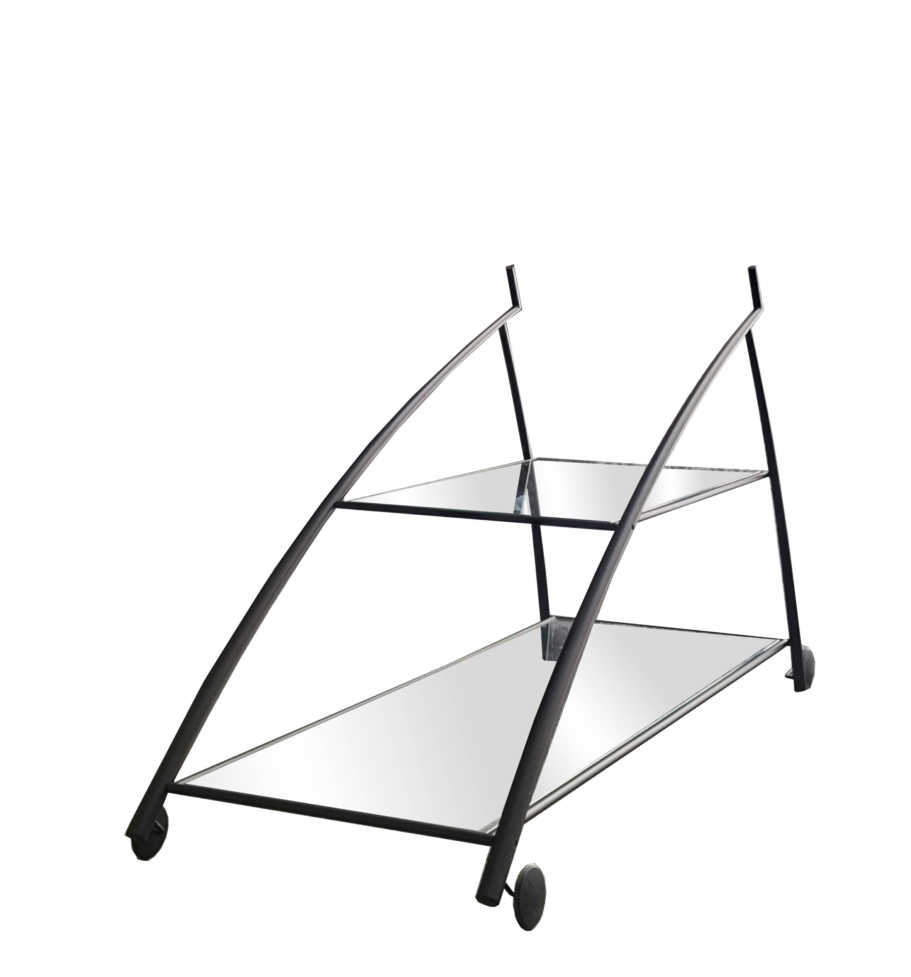 Rare and unique small table/trolley designed by Gilles Derain for the firm Lumen Center,
Black lacquered steel frame and transparent glass, in excellent condition, stamped trademark.
