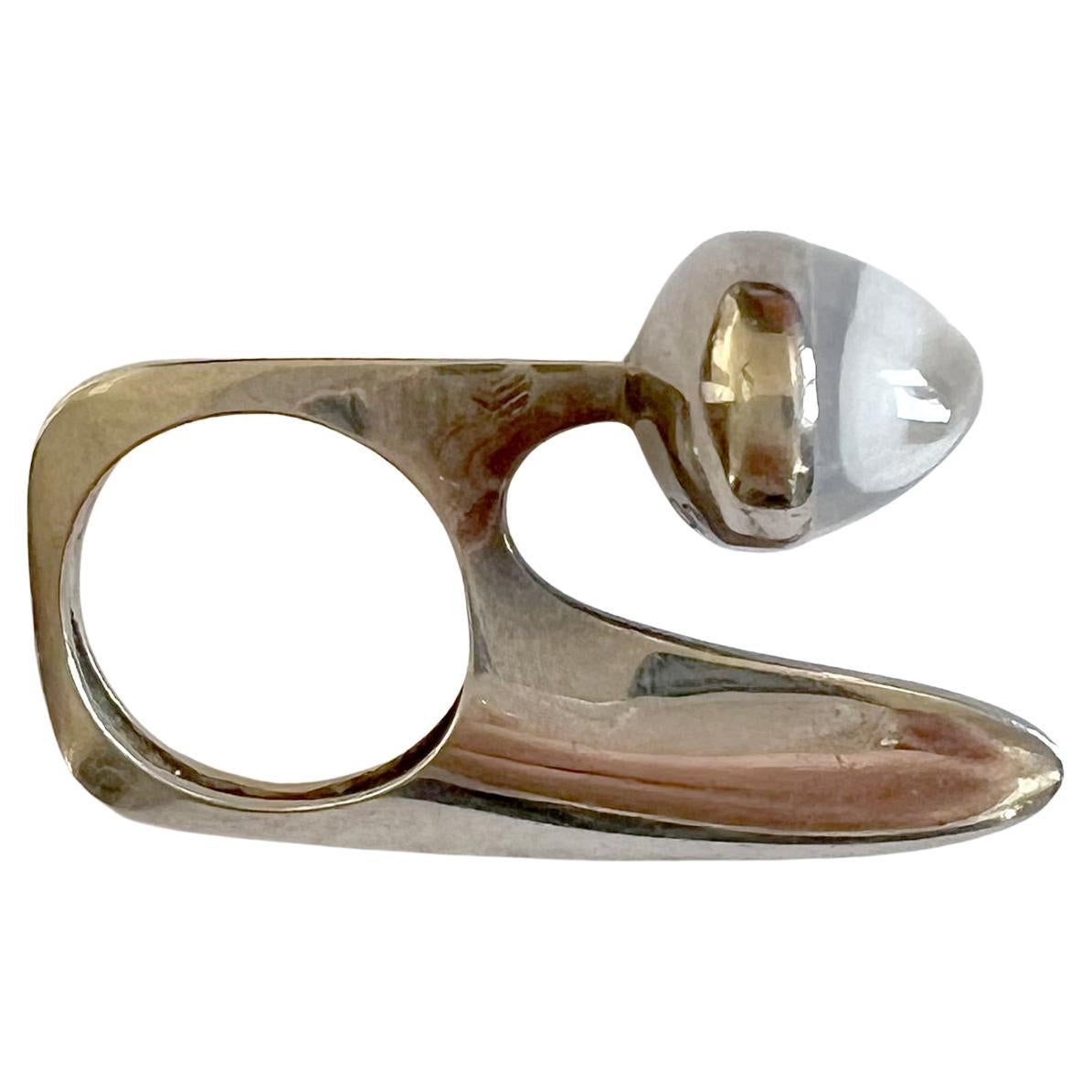 French abstract modernist sterling silver ring with oval, high domed moonstone cabochon created by Gilles Jonemann, circa 1970's.  Sculptural ring is a finger size 6.25 to 6.5 and is signed Jonemann with French hallmarks, 2.  A rare opportunity to