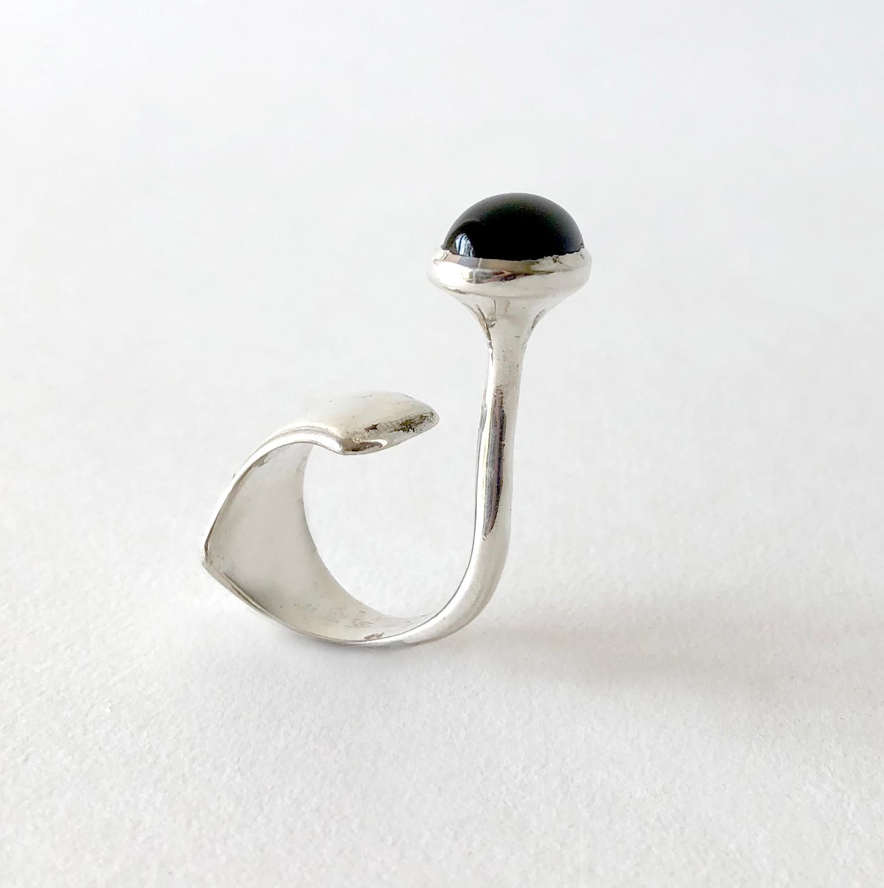 Sterling silver ring with dark smokey quartz cabochon created by an unknown French jeweler.  Ring is reminiscent of one that Vivianna Torun designed in the 1960's for Georg Jensen and also designs by Gilles Jonemann.  A finger size 6.5, the quartz