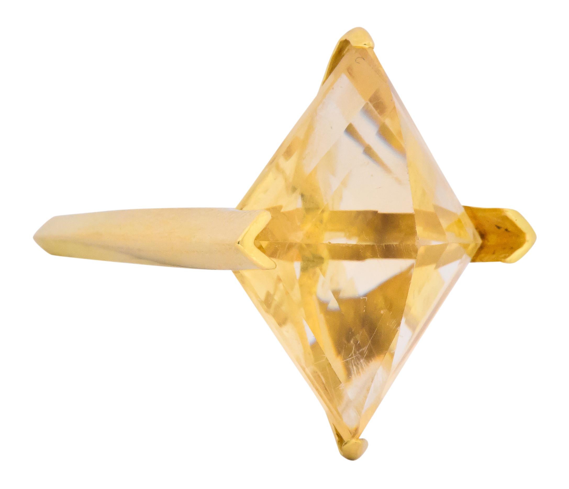 Centering a navette shaped, step and point cut citrine, measuring approximately 24.5 x 20.5 x 12.5 mm, bright medium yellow

In a geometric mount and shank

Signed GEP for Gillian Packard

With British hallmarks for 18 karat gold, London and