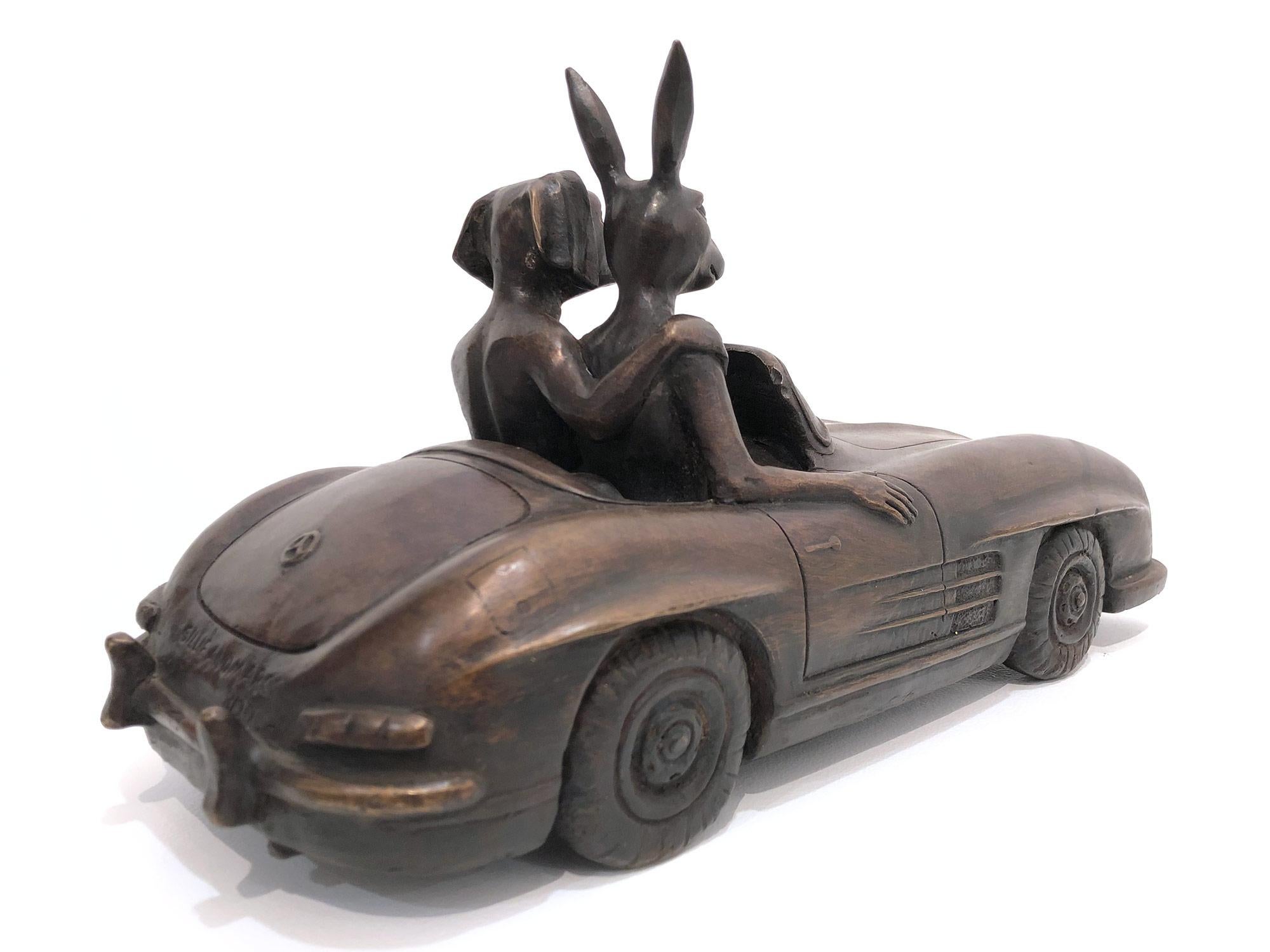 A whimsical yet very strong piece depicting the two figures from Gillie and Marc's iconic figures of the Dog/Bunny Human Hybrid, which has picked up much esteem across the globe. Here we find the figures embracing they ride in a Mercedes-Benz. This