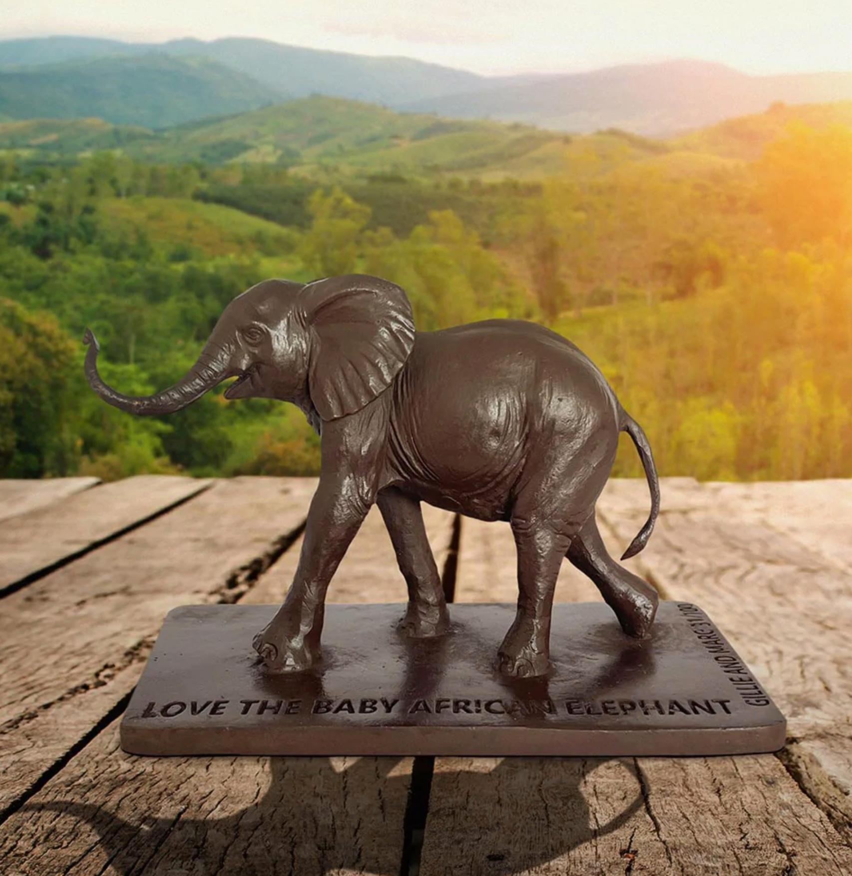 Title: Love the African Elephant
Authentic Bronze Sculpture

Description:
This authentic bronze sculpture titled 'Love the Baby African Elephant' by artists Gillie and Marc has been meticulously crafted in bronze. It features a baby African Elephant