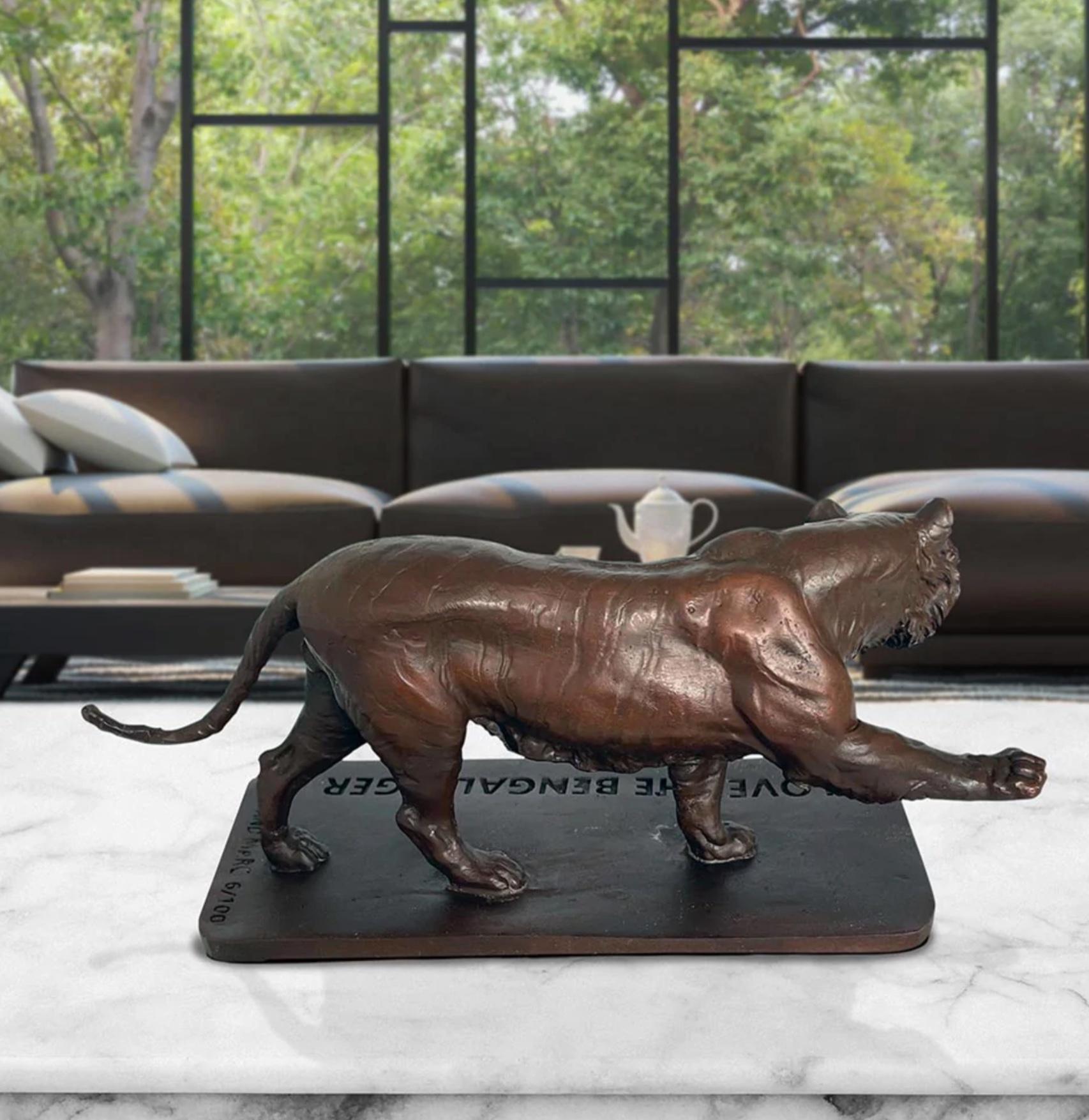 Title: Love the African Elephant
Authentic Bronze Sculpture


Description:
This authentic bronze sculpture titled 'Love the Bengal Tiger' by artists Gillie and Marc has been meticulously crafted in bronze. It features a baby African Elephant