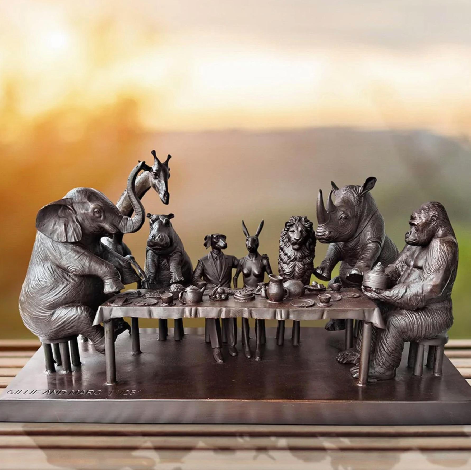 Title: Wild Tea Party
Authentic Bronze Sculpture

This authentic bronze sculpture titled 'Wild Tea Party' by artists Gillie and Marc has been meticulously crafted in bronze. It features a Gillie and Marcs famous Dogman and Rabbitwoman sitting at the