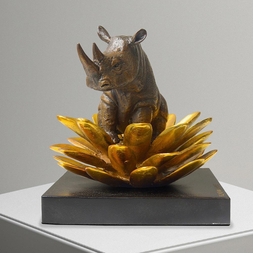Title: The rhino was in golden bloom
Authentic bronze sculpture

This authentic bronze sculpture titled 'The hippo was in golden bloom' by artists Gillie and Marc has been meticulously crafted in bronze. It features a Hippo standing on a gold patina