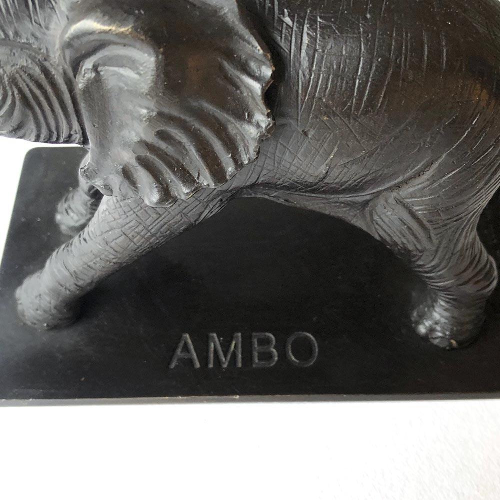 Title: Ambo
Authentic bronze sculpture with bronze patina

This authentic bronze sculpture titled 'Ambo' by artists Gillie and Marc has been meticulously crafted in bronze. It features a Hippo standing on a gold patina flower and comes in a