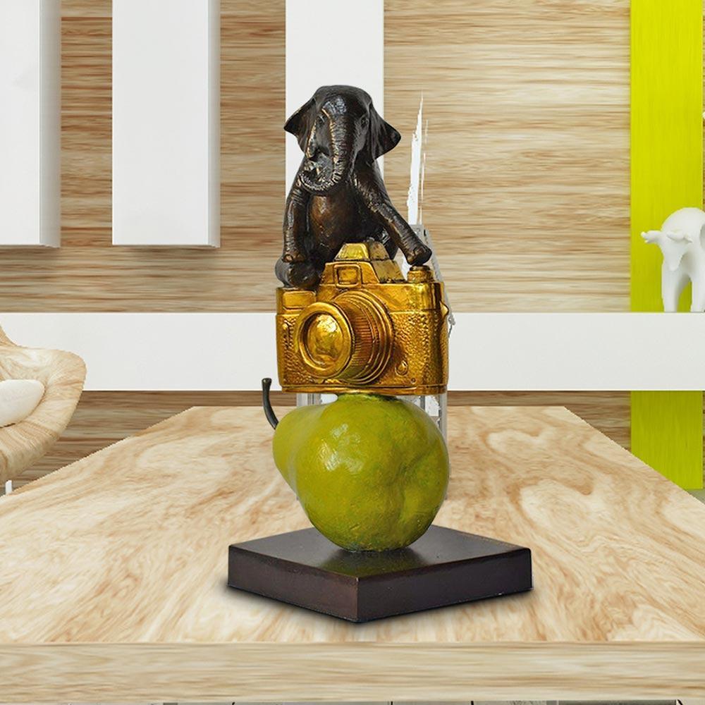 Title: The Elephant just wanted a camera and a pear
Authentic bronze sculpture with gold and green patina
Limited Edition

World Famous Contemporary Artists: Husband and wife team, Gillie and Marc, are New York and Sydney-based contemporary artists