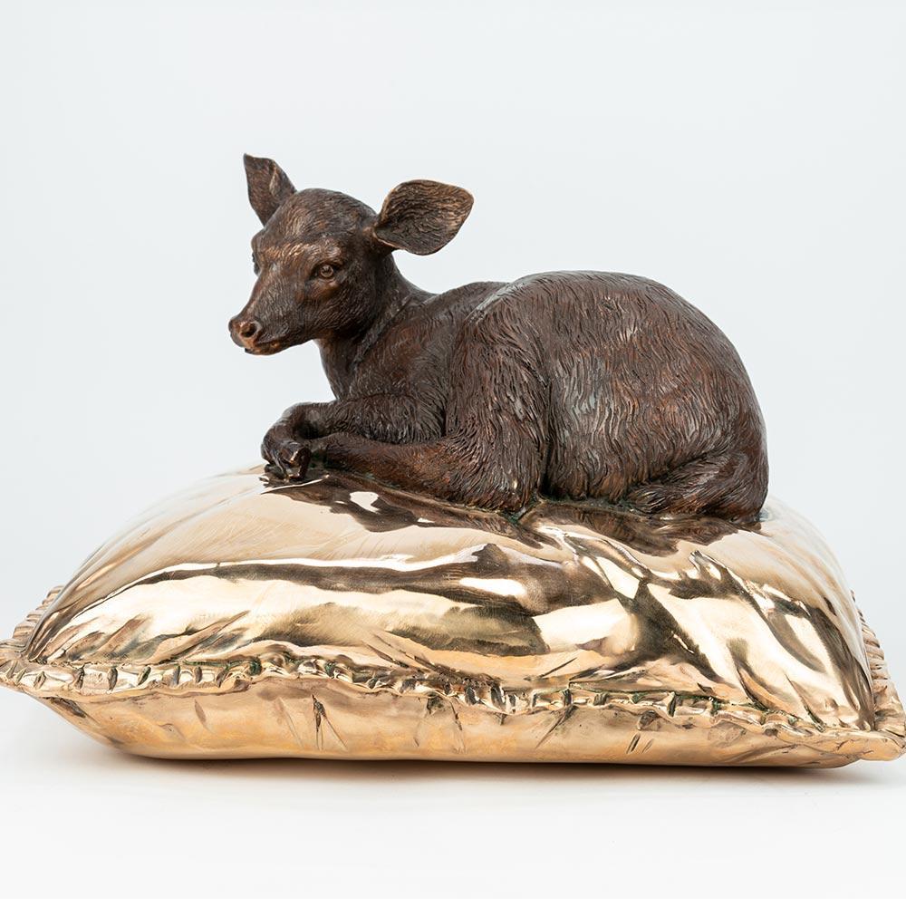 Title: Sleeping Beauty Deer 
Authentic Bronze Sculpture

Description:
This authentic bronze sculpture titled 'Sleeping Beauty Deer' by artists Gillie and Marc has been meticulously crafted in bronze. It features a Deer having a fabulous nap on a