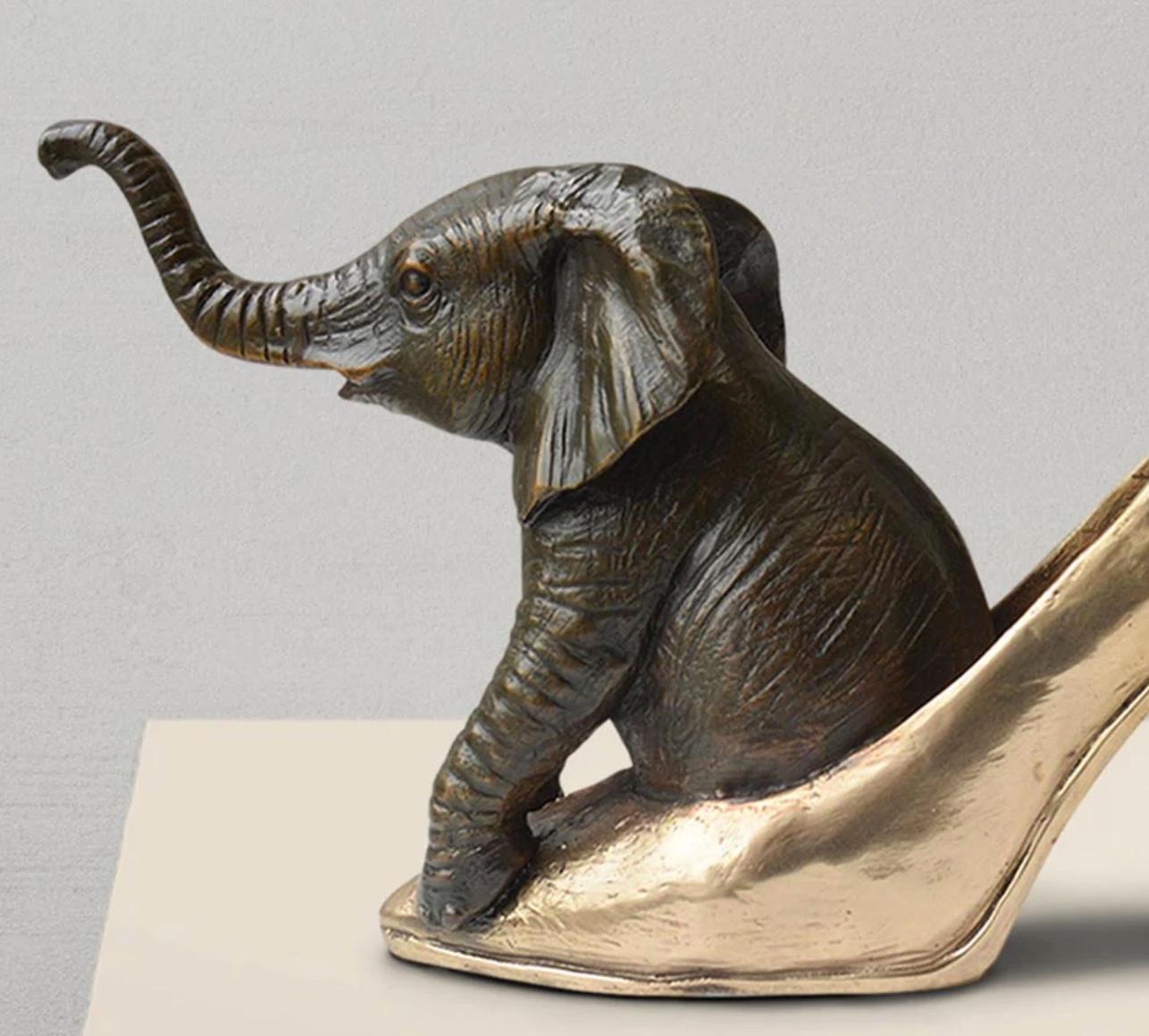 Titled: Walk With The Elephant
Authentic Bronze Sculpture

This authentic bronze sculpture titled 'Walk With The Elephant' by artists Gillie and Marc has been meticulously crafted in bronze. It features a Hippo standing on a gold patina flower and