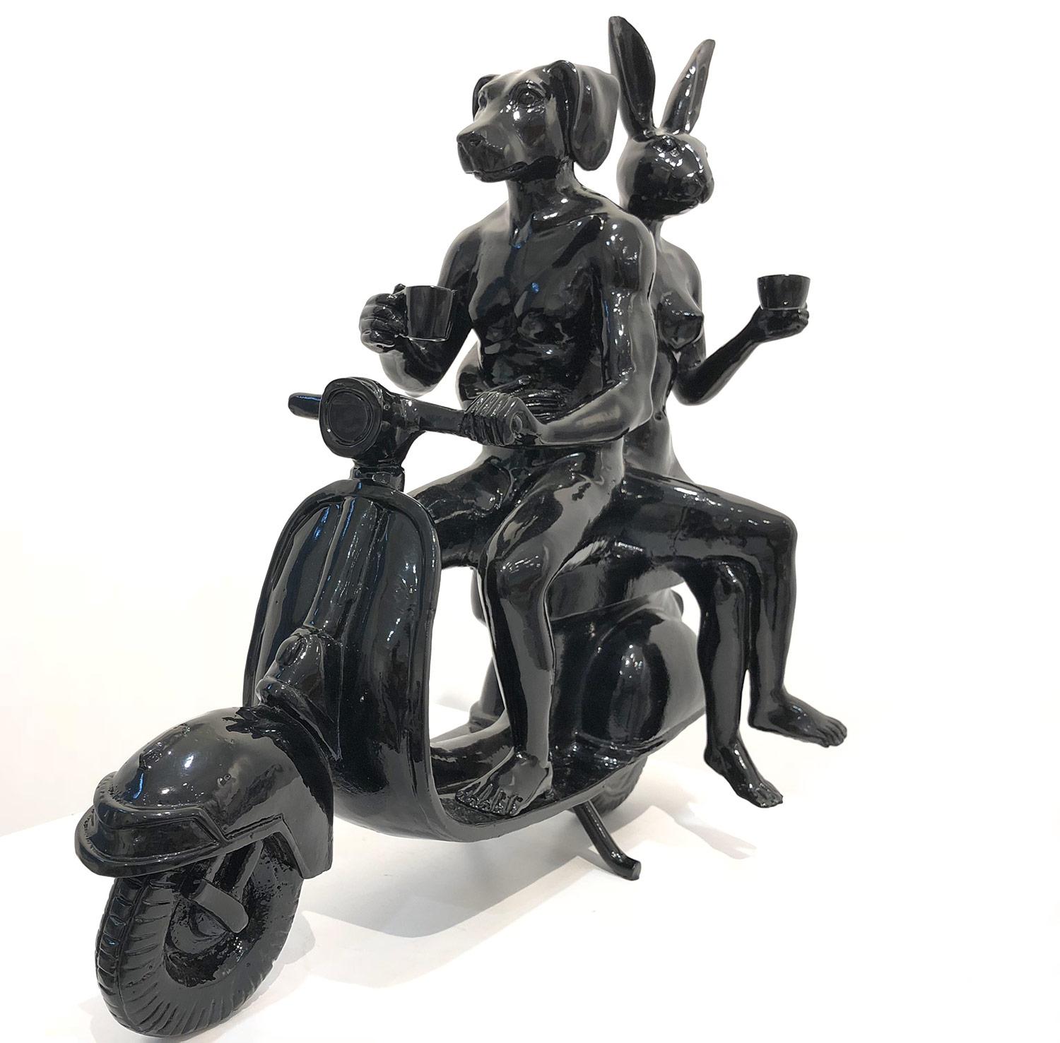 A whimsical yet very strong piece depicting the two figures from Gillie and Marc's iconic figures of the Dog/Bunny Human Hybrid, which has picked up much esteem across the globe. Here we find the figures riding on a Vespa as they embrace drinking