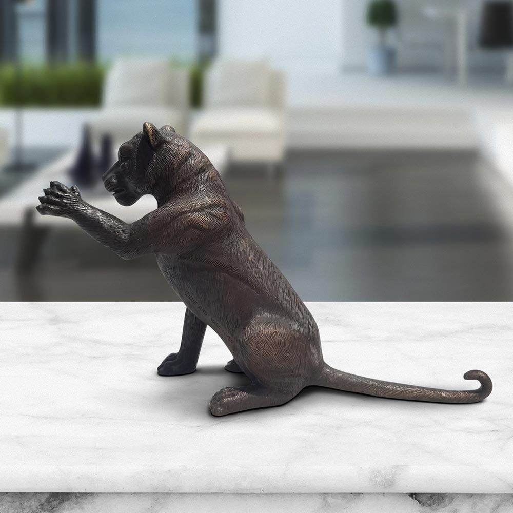 Title: The Cub Said Hi
Authentic bronze sculpture

This authentic bronze sculpture titled 'The Cub Said Hi' by artists Gillie and Marc has been meticulously crafted in bronze. It features a cub saying hi and comes in a limited-edition series of only