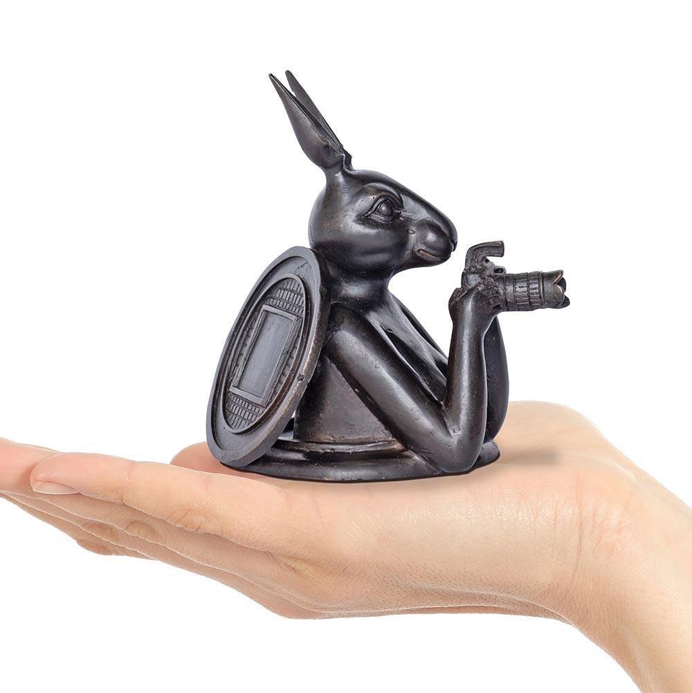 Title: Paparazzi Rabbit comes into a better tomorrow
Authentic bronze sculpture

Description:
This authentic bronze sculpture titled 'Paparazzi Rabbit comes into a better tomorrow' by artists Gillie and Marc has been meticulously crafted in bronze.