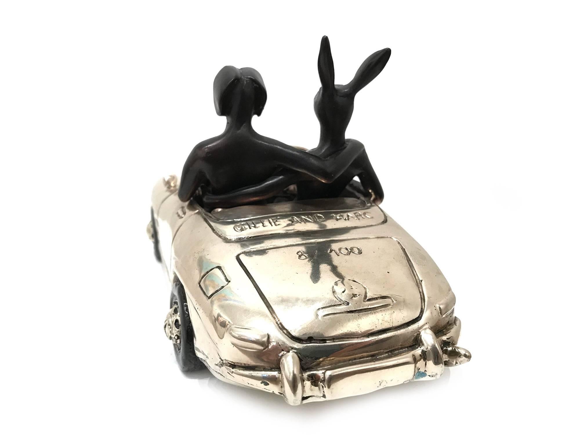 A whimsical yet very strong piece depicting the two figures from Gillie and Marc's iconic figures of the Dog/Bunny Human Hybrid, which has picked up much esteem across the globe. Here we find the figures embracing they ride in a Mercedes-Benz. This