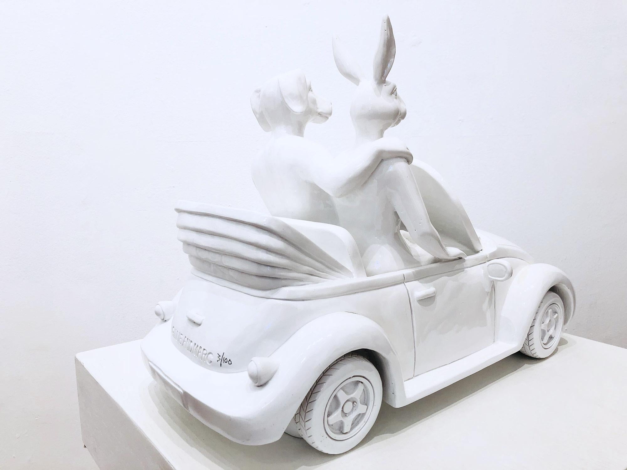 A whimsical yet very strong piece depicting the two figures from Gillie and Marc's iconic figures of the Dog/Bunny Human Hybrid, which has picked up much esteem across the globe. Here we find the figures embracing they ride in a Convertible Beetle.