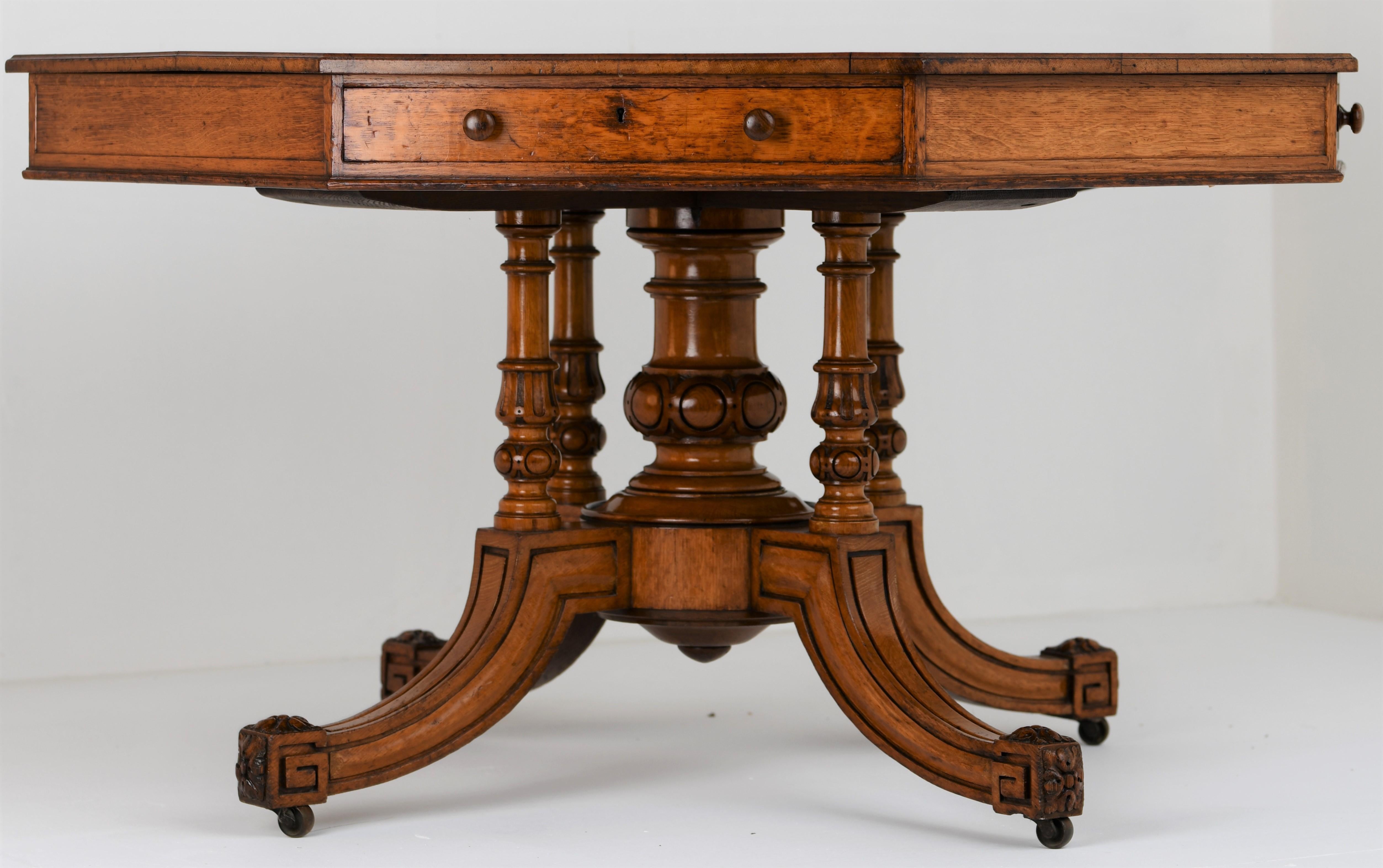 Stamped and numbered oak octagonal drum Gillow and Co. pedestal table, circa 1860. Untouched and 100% authentic with just shy of 160 years of patina. This is a important museum grade item that's still very functional today this day. Having 4 sets of
