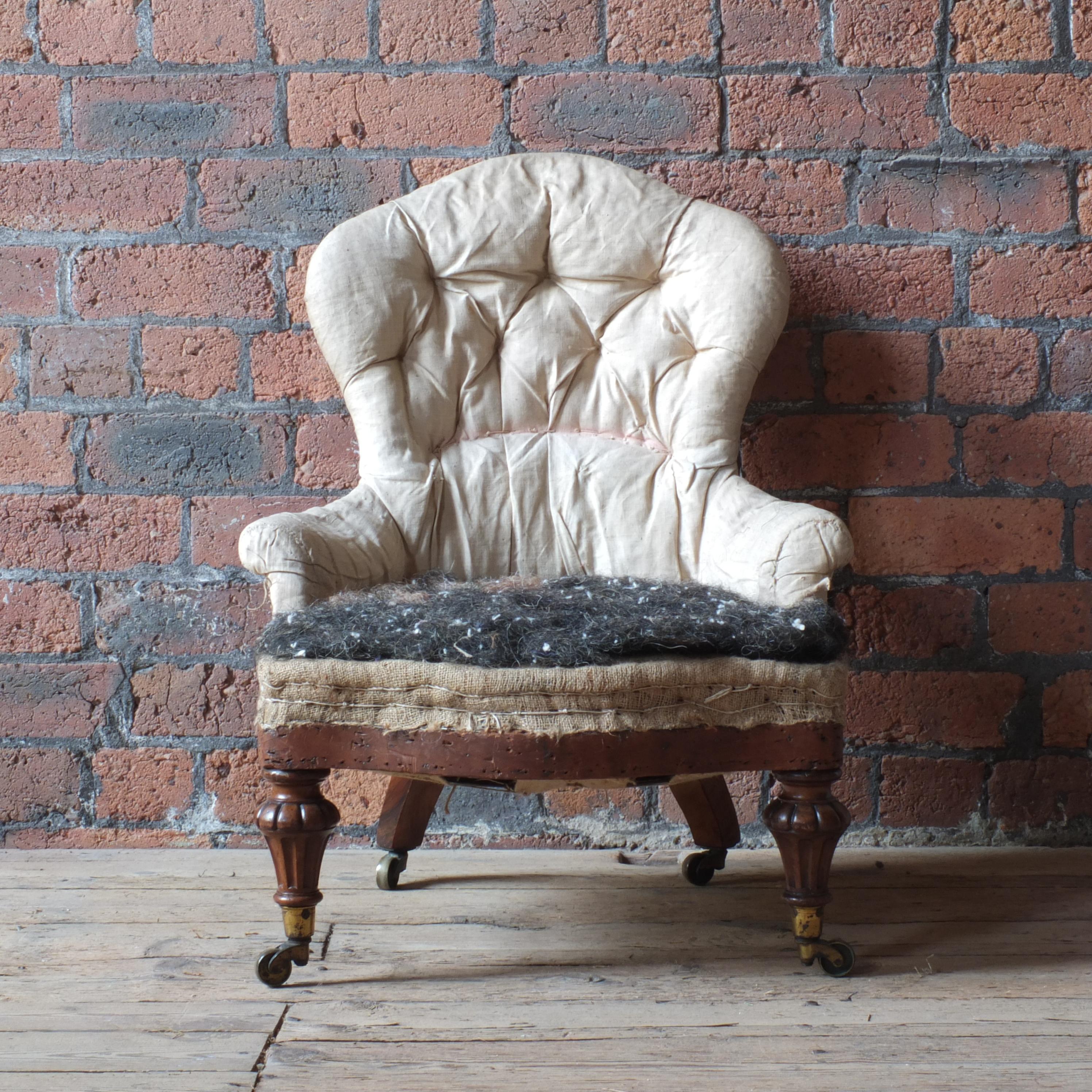 A good quality Gillows iron back nursing chair. Raised on walnut turned and carved walnut front legs with the rear legs both stamped Gillows and all raised on the original Cope & Collinson Strong patent casters. English c1860

Stripped down to its