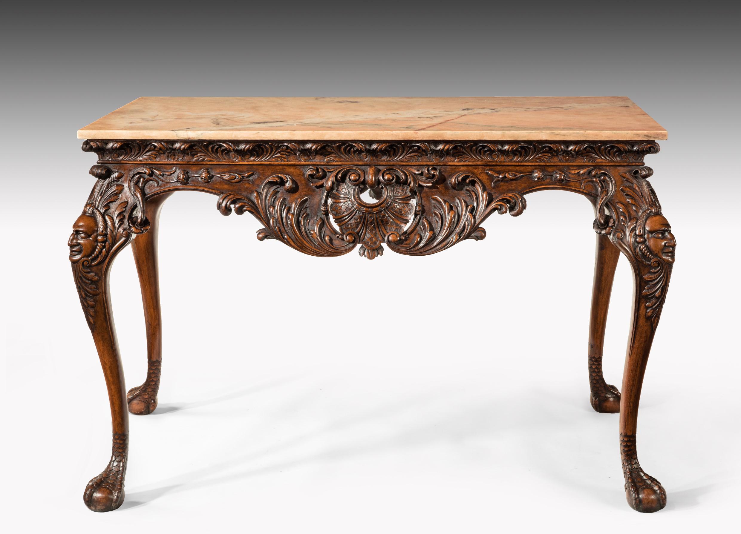 A finely carved 19th century marble topped walnut centre table stamped Gillows.

English, circa 1860.

The later rectangular Lamartine marble top sits above an acanthus carved frieze with central scrolling and shell-carved serpentine apron.