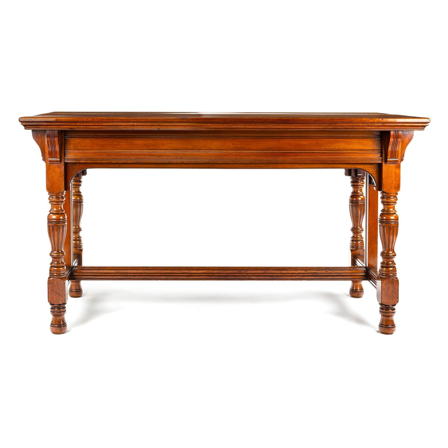 Gillows late 19th C library table in American black walnut, styled after Pugin. The carving is very crisp.

Gillows of Lancaster and London, also known as Gillow & Co., was an English furniture making firm based in Lancaster, Lancashire, and in