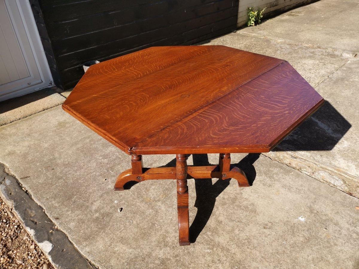 Bruce Talbert attributed for Gillows of Lancaster and London.
A rare Aesthetic Movement oak octagonal drop-leaf centre or dining table with wonderful figuring to the top. On one side there is a drop leaf that has a sliding support to hold it up or