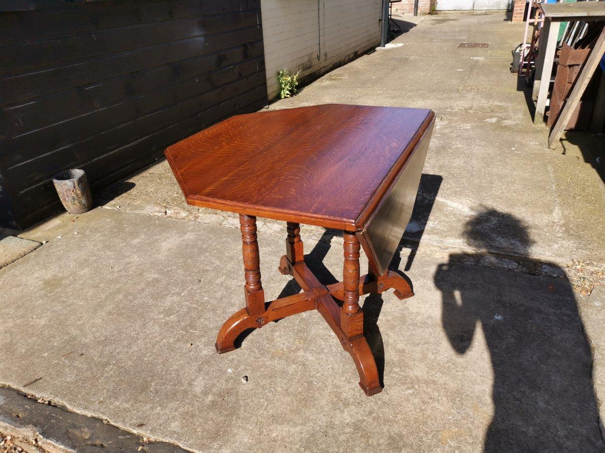 English Gillows, an Aesthetic Movement Oak Octagonal Drop-Leaf Centre Table with Florets