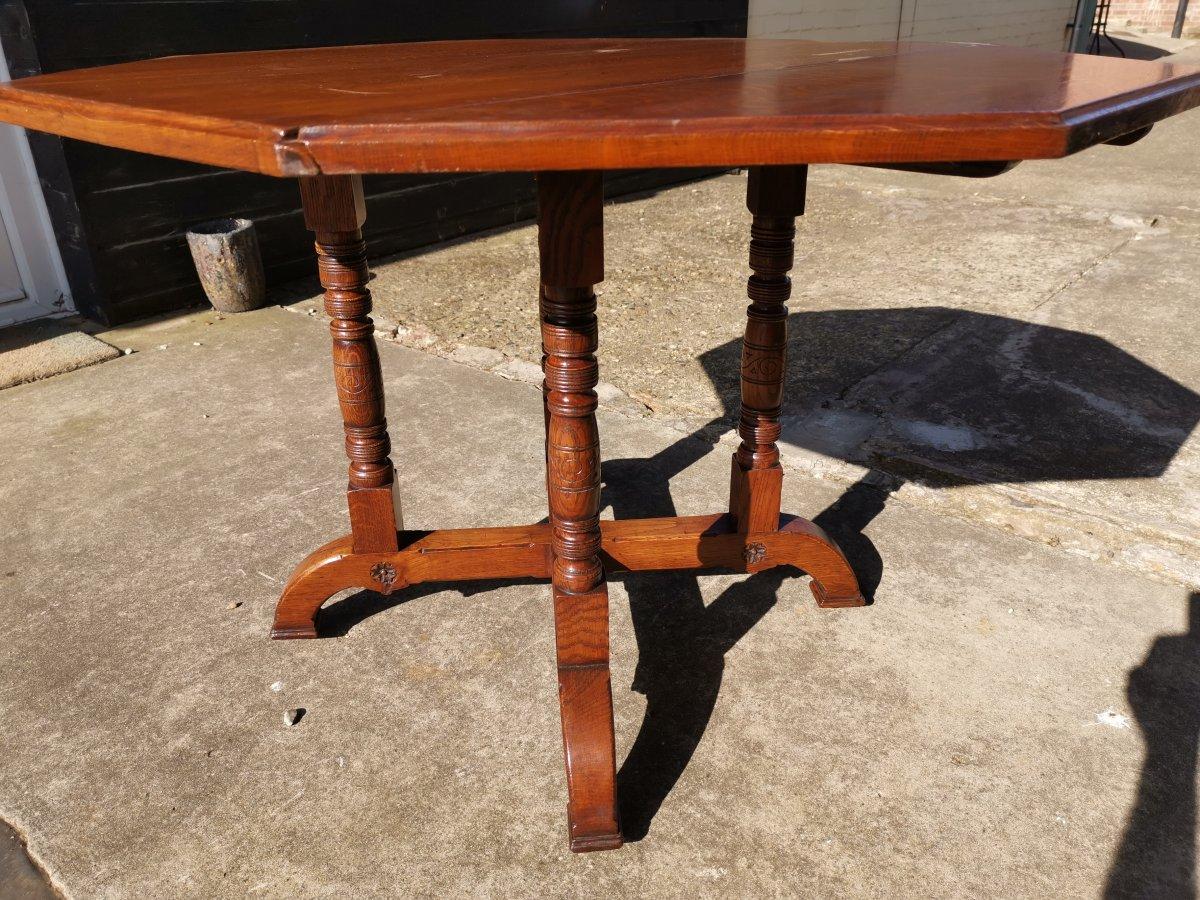 Gillows, an Aesthetic Movement Oak Octagonal Drop-Leaf Centre Table with Florets 2