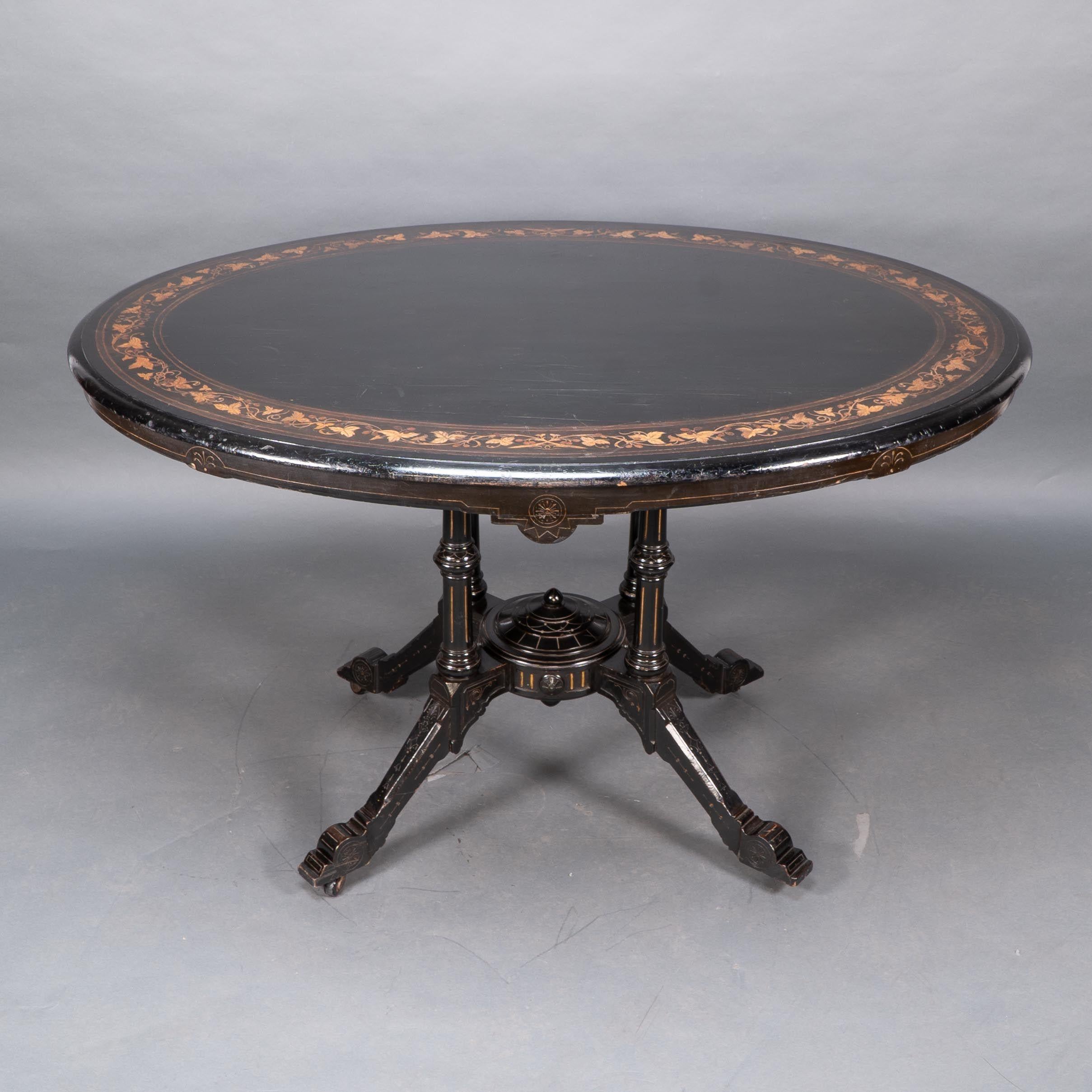 Walnut Gillows attr. An Aesthetic Movement tilt top dining table with floral inlays For Sale