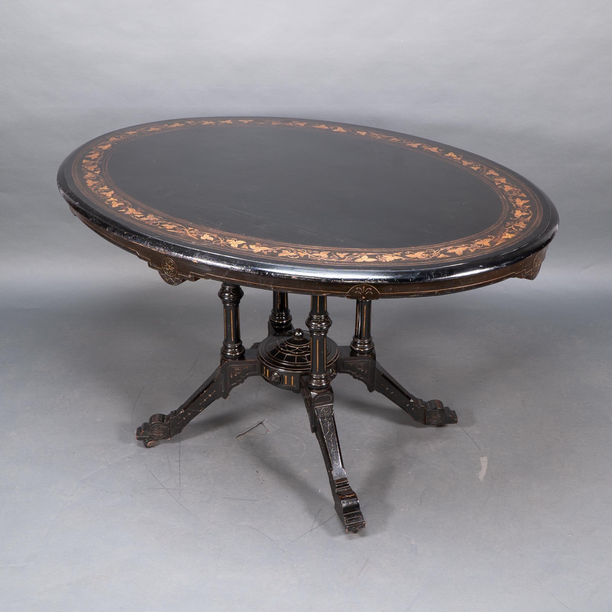 Gillows attr. An Aesthetic Movement tilt top dining table with floral inlays For Sale 1