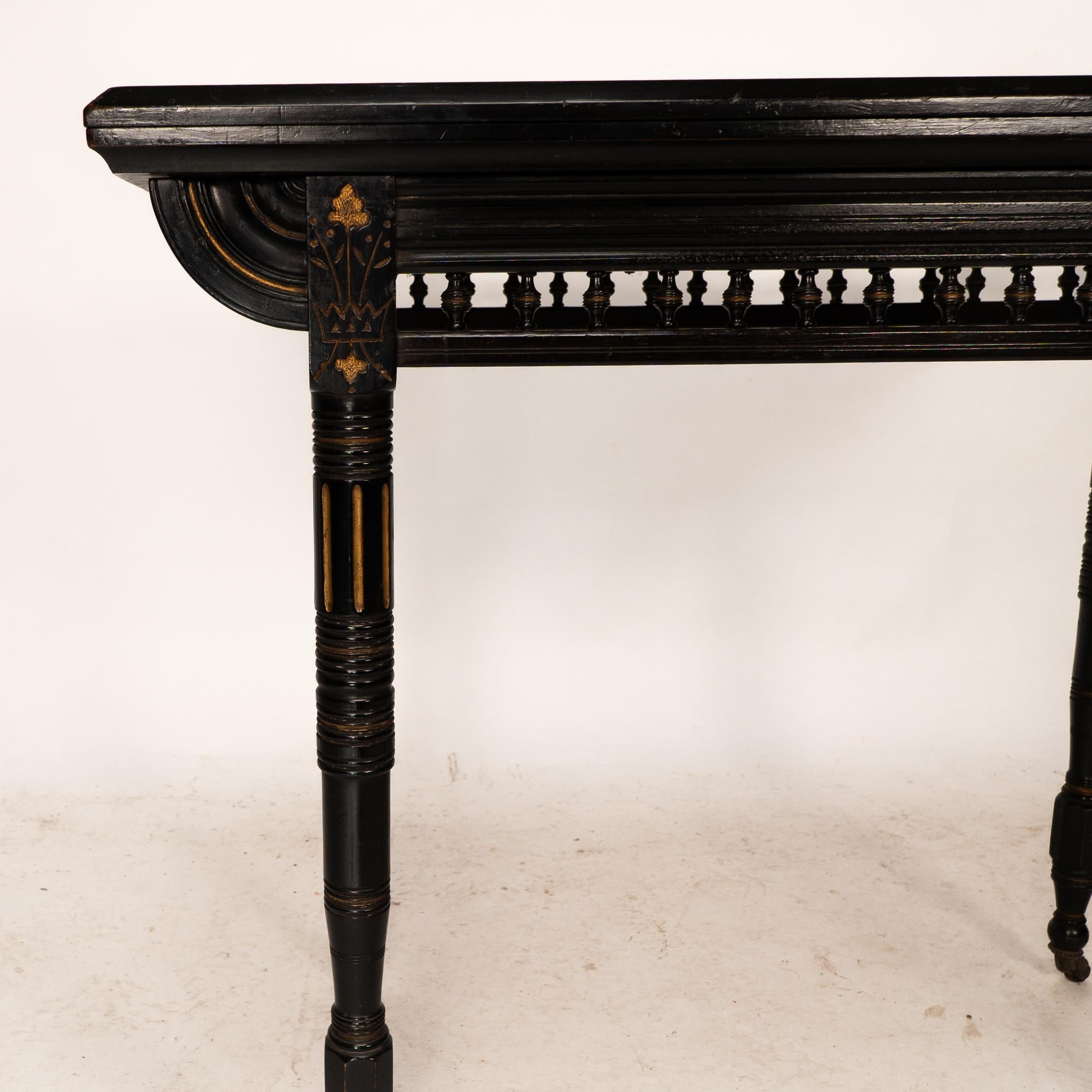 Gillows attributed. An Aesthetic Movement ebonized games and card table 8