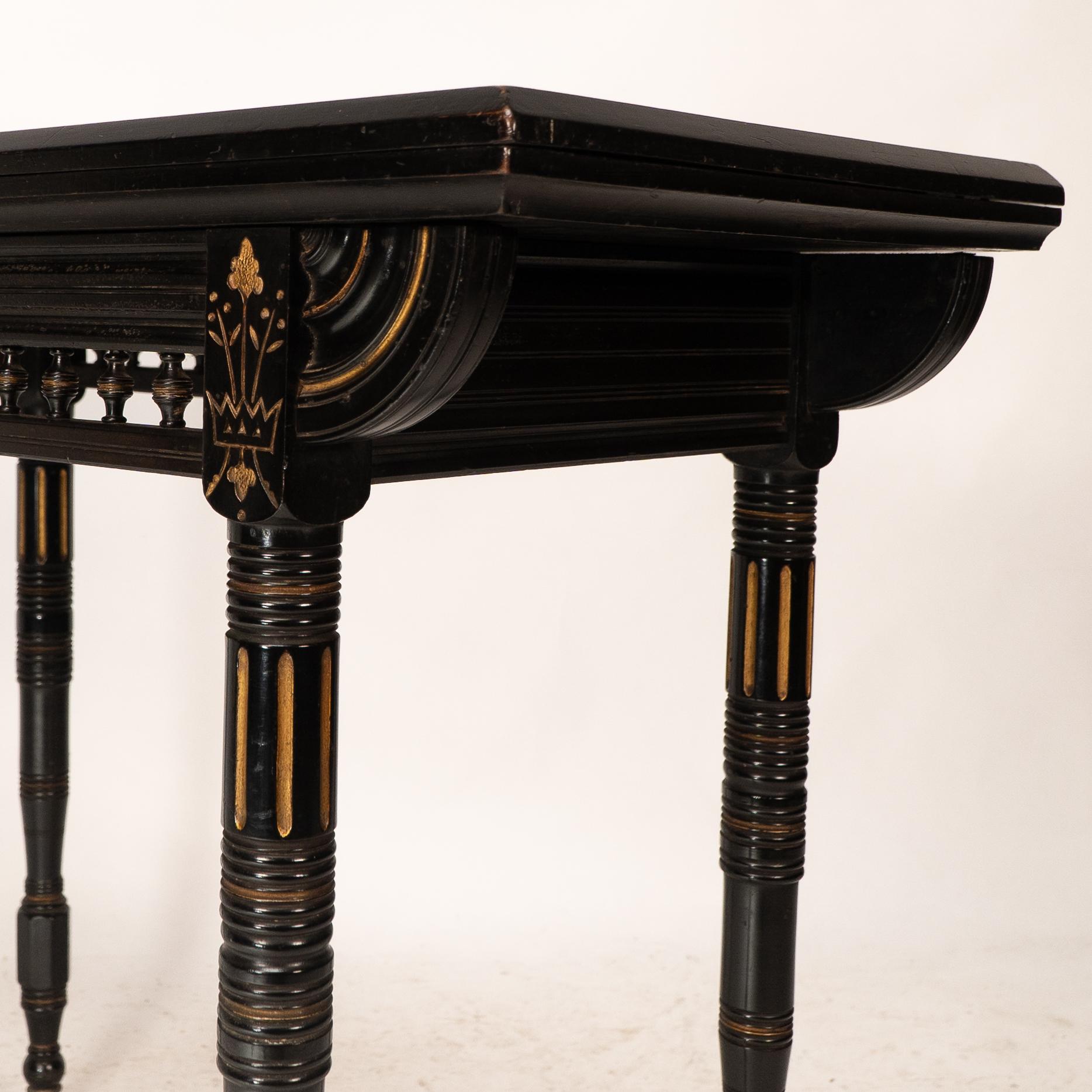 Gillows attributed. An Aesthetic Movement ebonized games and card table 10