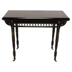 Gillows attributed. An Aesthetic Movement ebonized games and card table