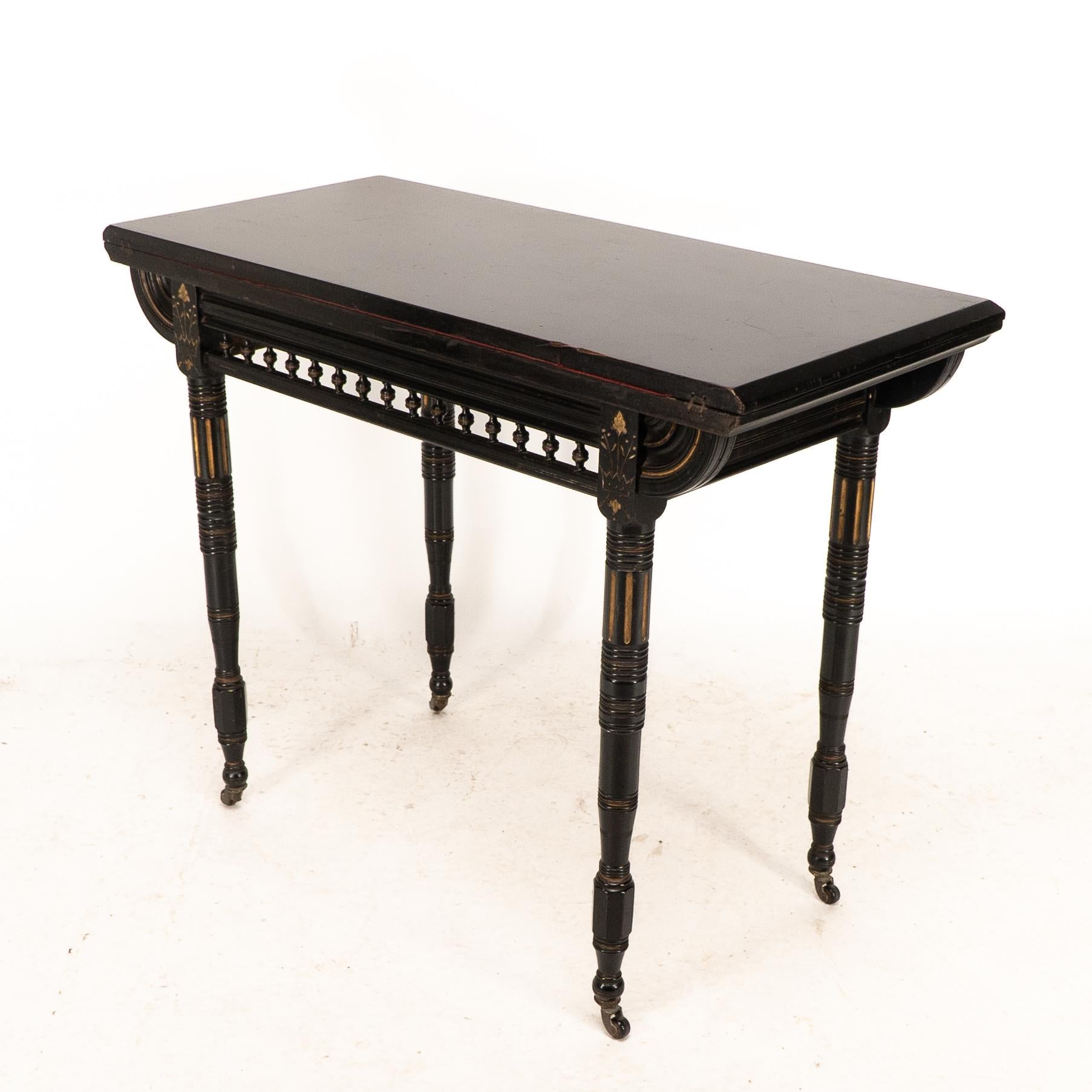 Ebonized Gillows attributed. An Aesthetic Movement ebonized games and card table