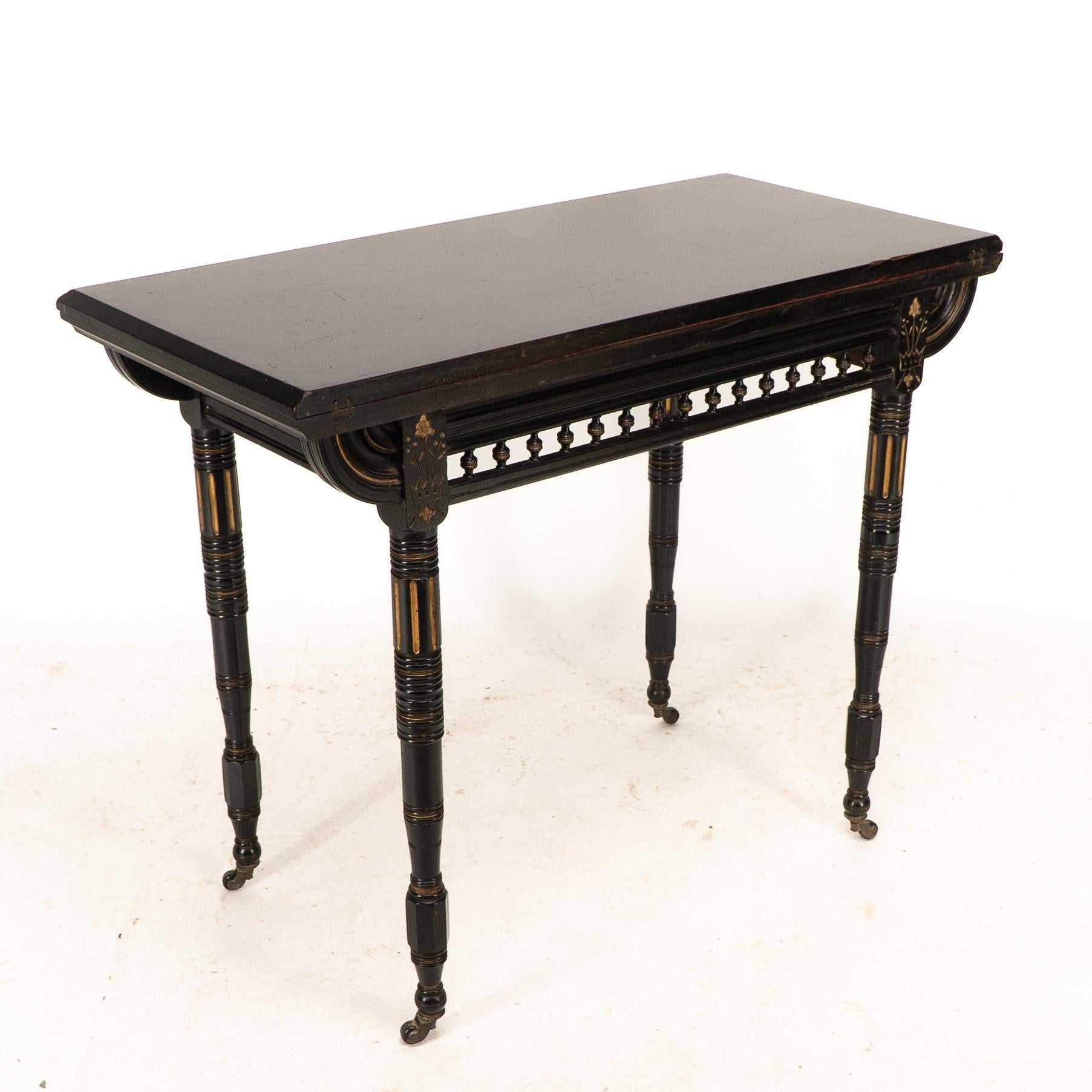Late 19th Century Gillows attributed. An Aesthetic Movement ebonized games and card table