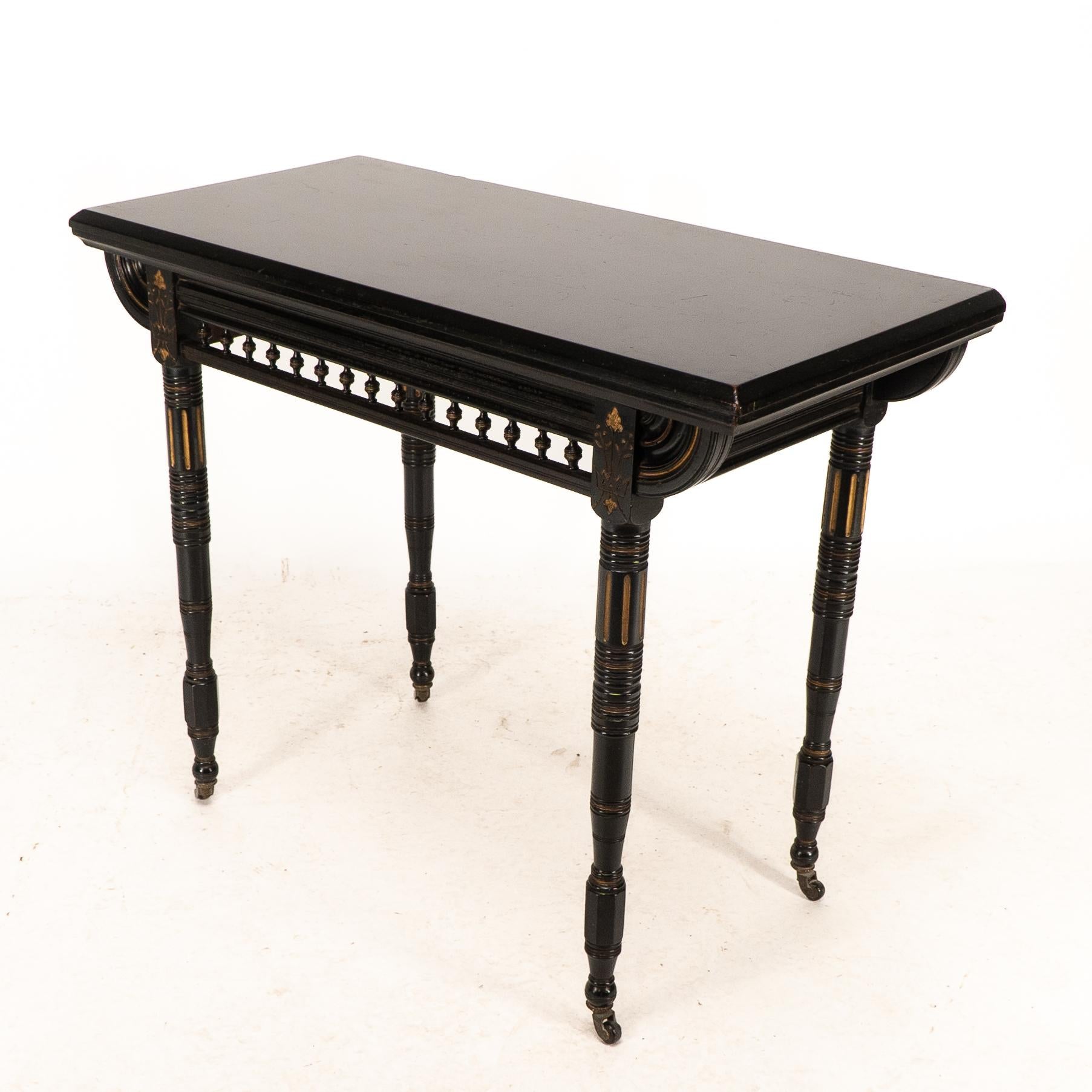 Gillows attributed. An Aesthetic Movement ebonized games and card table 1