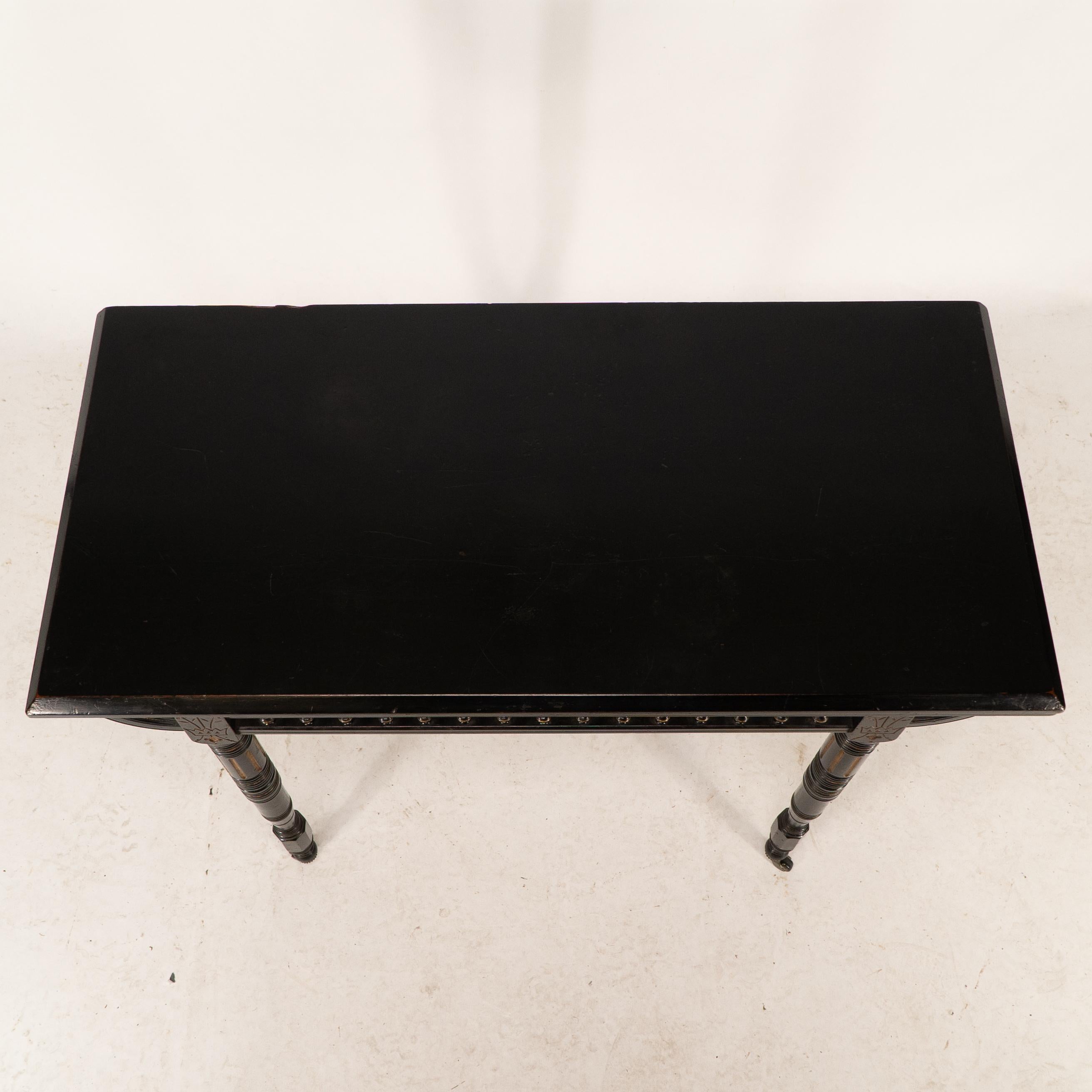 Gillows attributed. An Aesthetic Movement ebonized games and card table 2